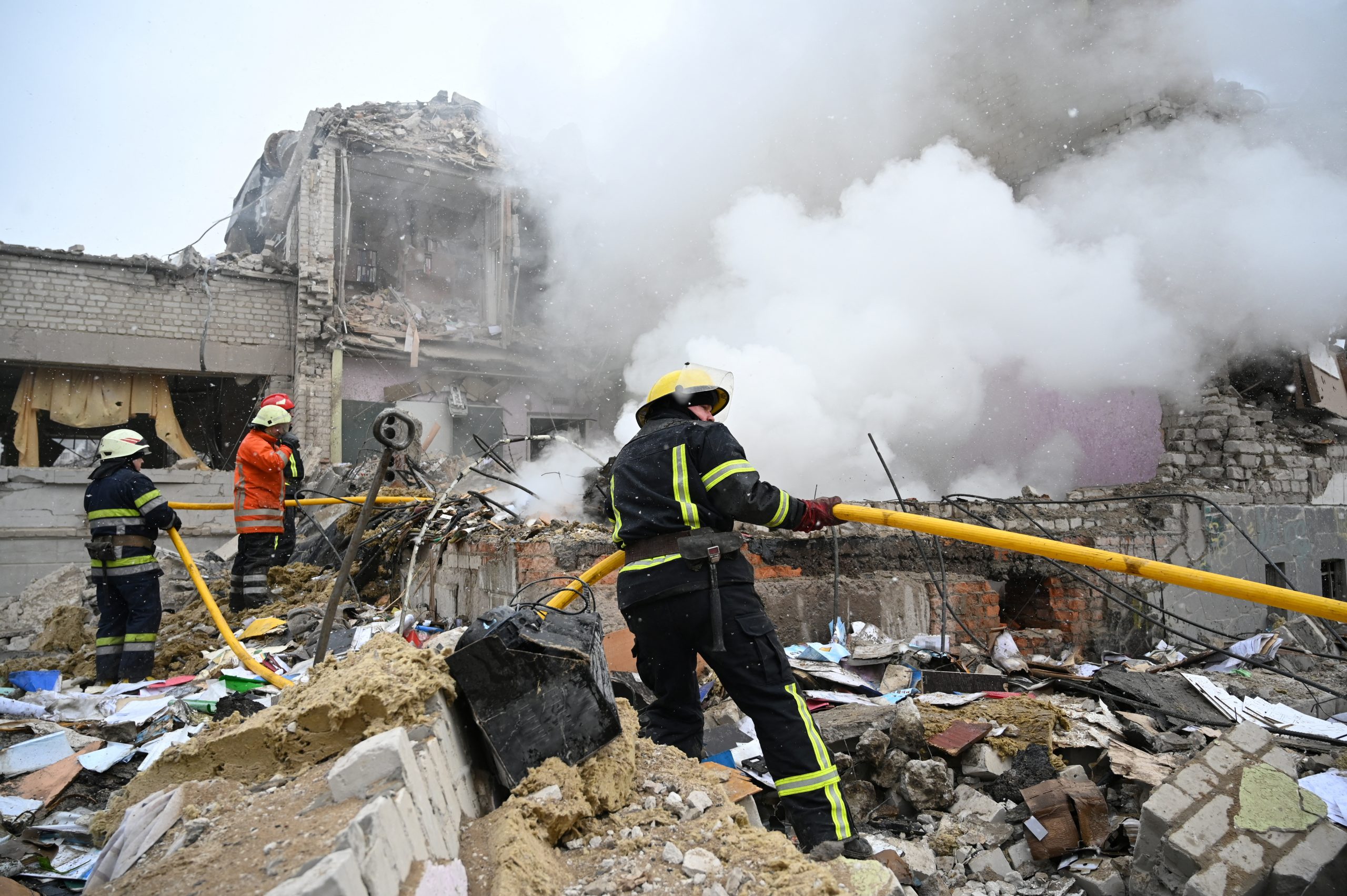 Rescuers work amidst the debris of a school building destroyed by shelling, as Russia's invasion of Ukraine continues, in Zhytomyr, Ukraine March 4, 2022. REUTERS/Viacheslav Ratynskyi