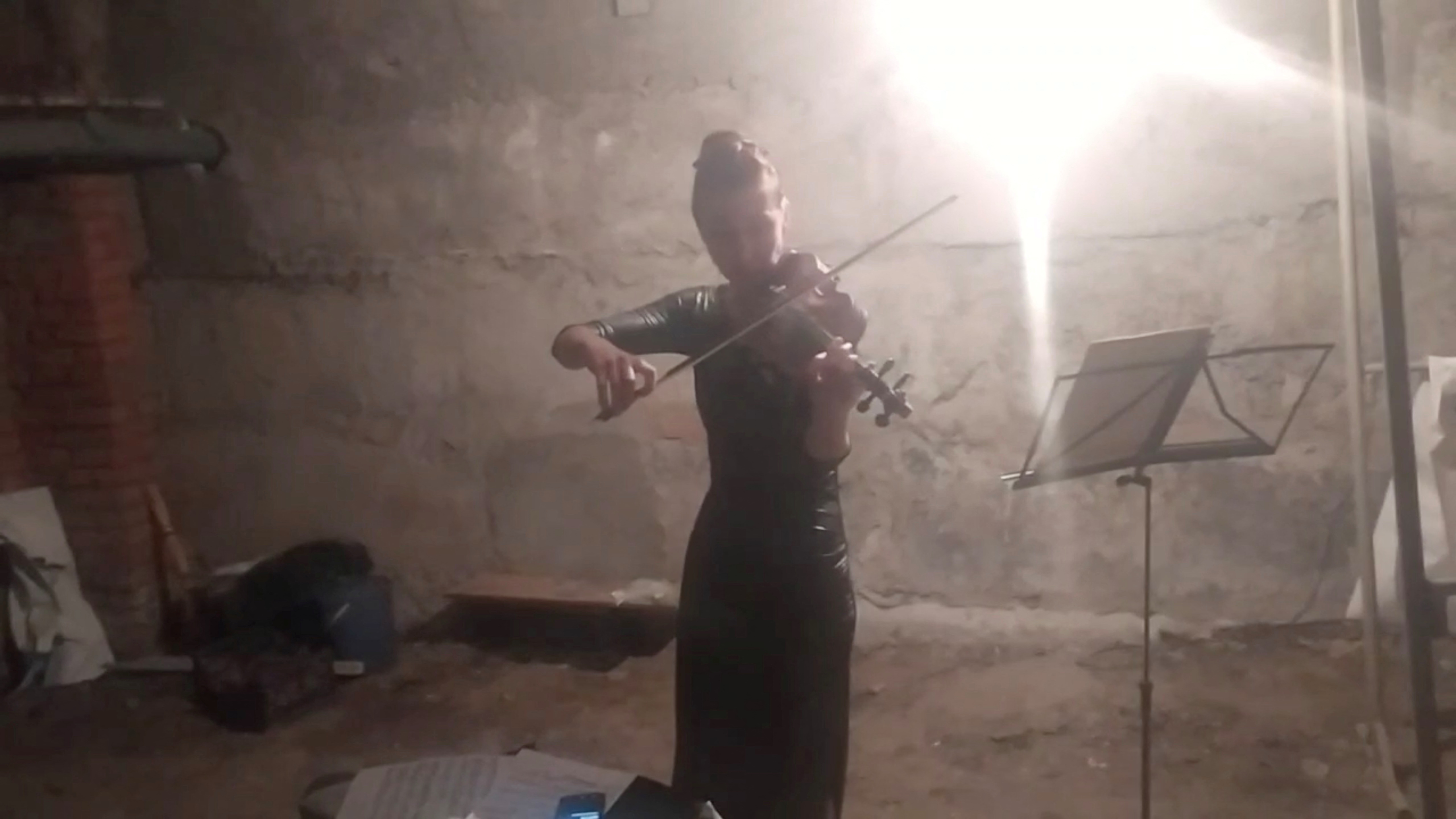 Violinist plays her violin in a bomb shelter in Kharkiv