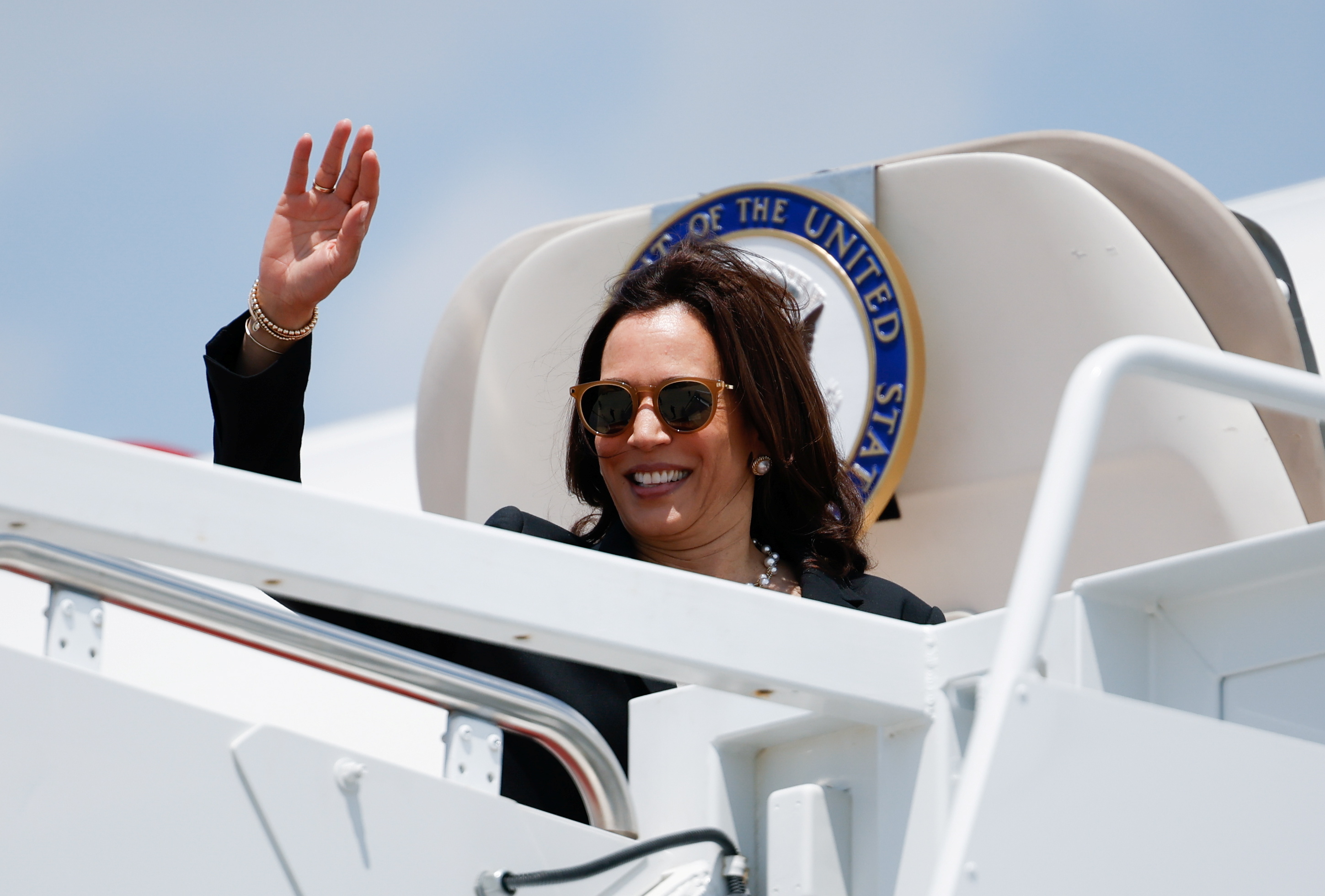 U.S. Vice President Kamala Harris waves as she boards Air Force Two for her first international trip as Vice President to Guatemala and Mexico, at Joint Base Andrews, Maryland, U.S., June 6, 2021. REUTERS/Carlos Barria