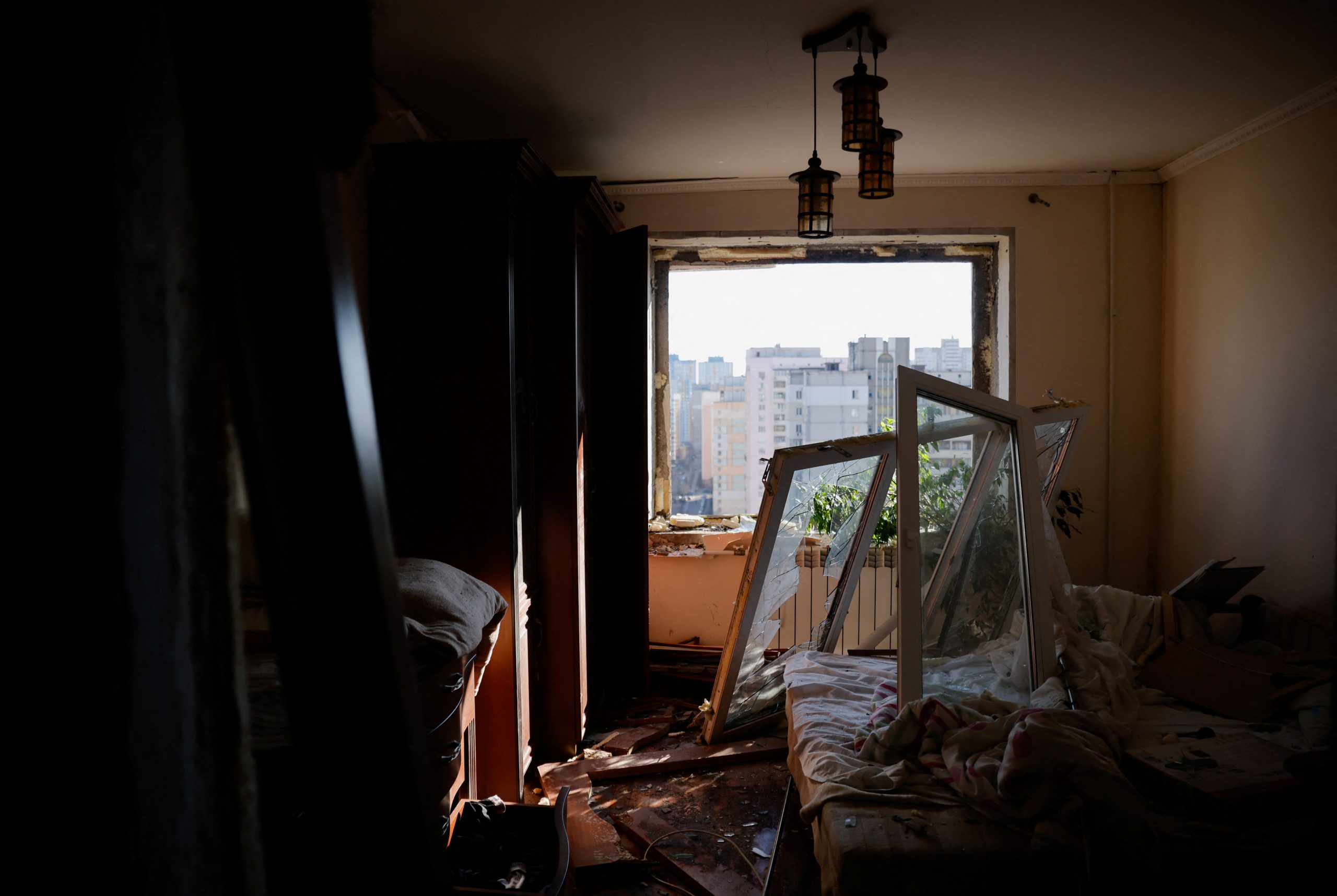 A view of a bedroom in a damaged apartment after an intercepted missile hit a residential building in Kyiv, Ukraine March 17, 2022. REUTERS/Thomas Peter