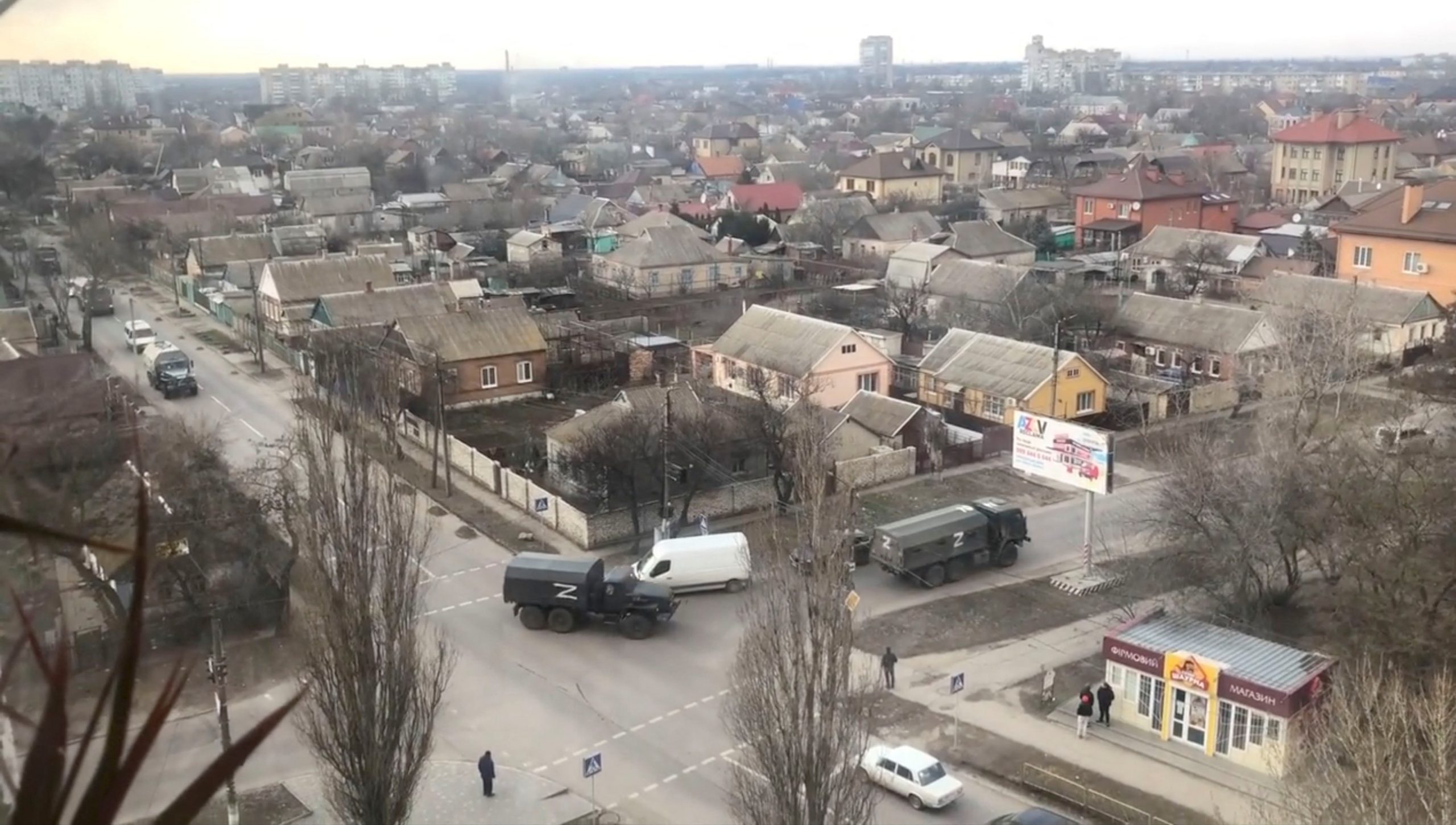 Trucks painted with Z markings make a turn at a junction, amid ongoing Russia's invasion of Ukraine, in Berdyansk, Ukraine, in this screengrab taken from video uploaded March 17, 2022 obtained by REUTERS.    THIS IMAGE HAS BEEN SUPPLIED BY A THIRD PARTY