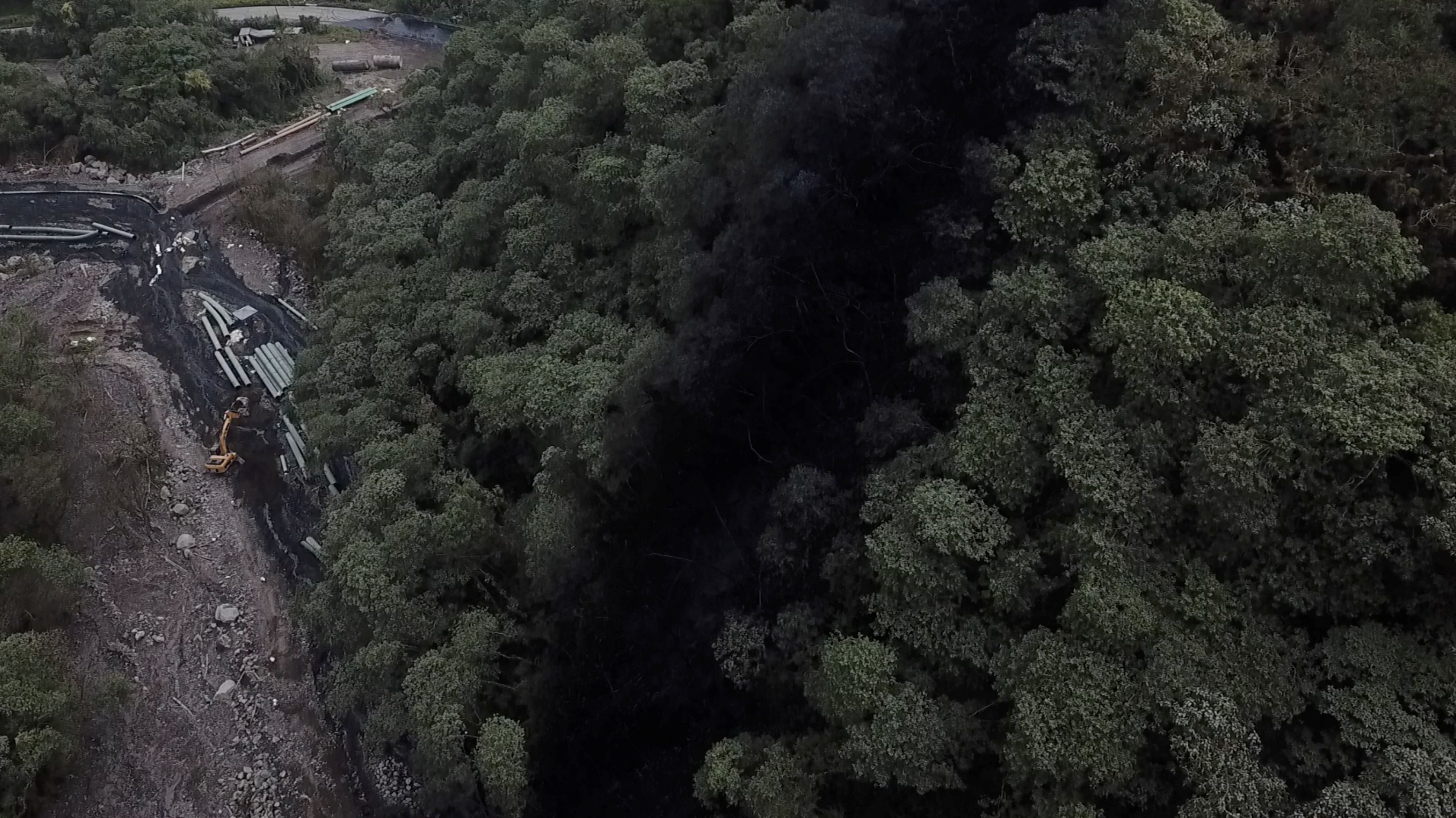 Spillage from an oil pipeline rupture and damage to tree tops is seen in Piedra Fina, Ecuador