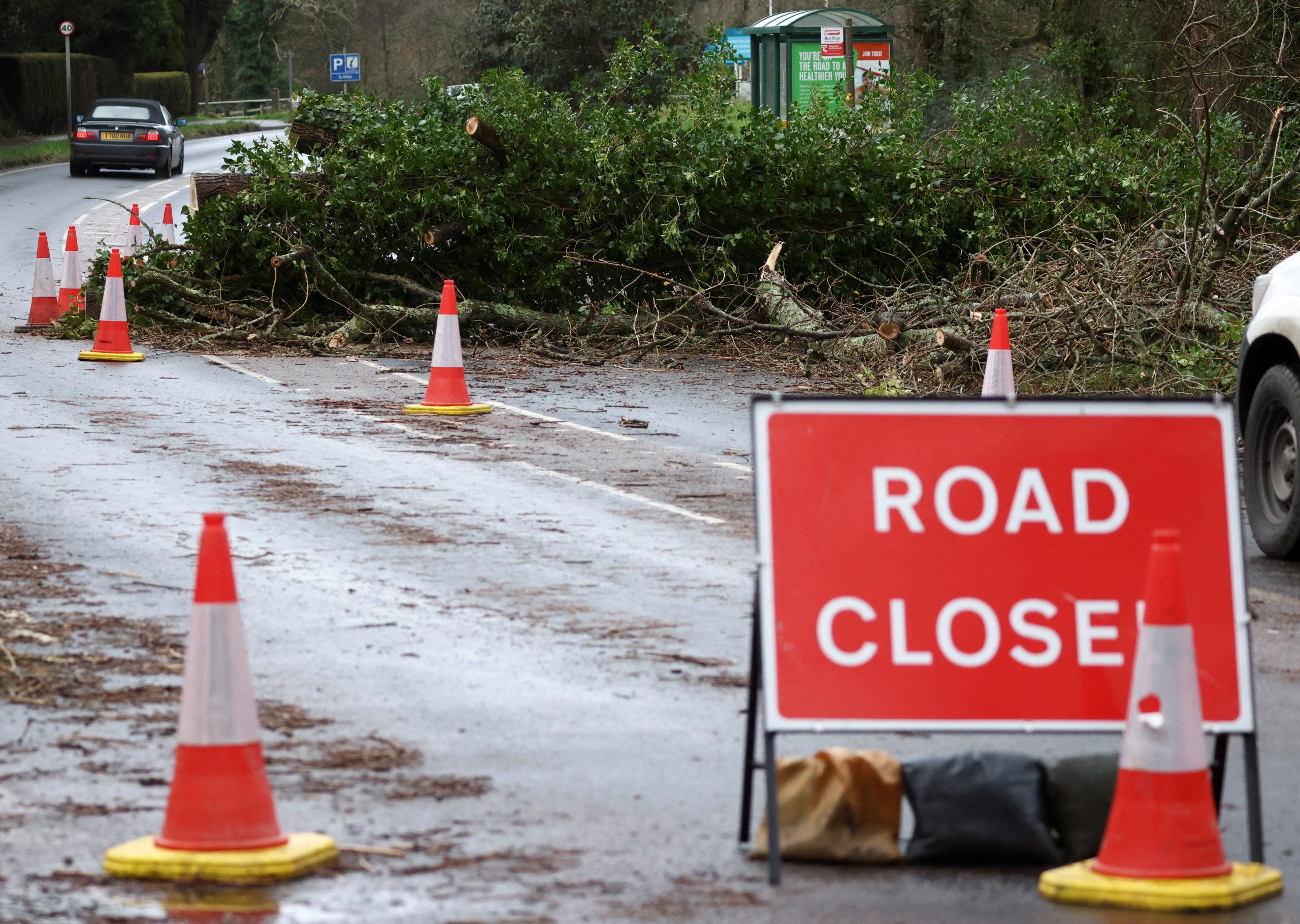A tree blocks the B3273 road after Storm Eunice, in St Austell, Cornwall, Britain, February 19, 2022. REUTERS/Tom Nicholson