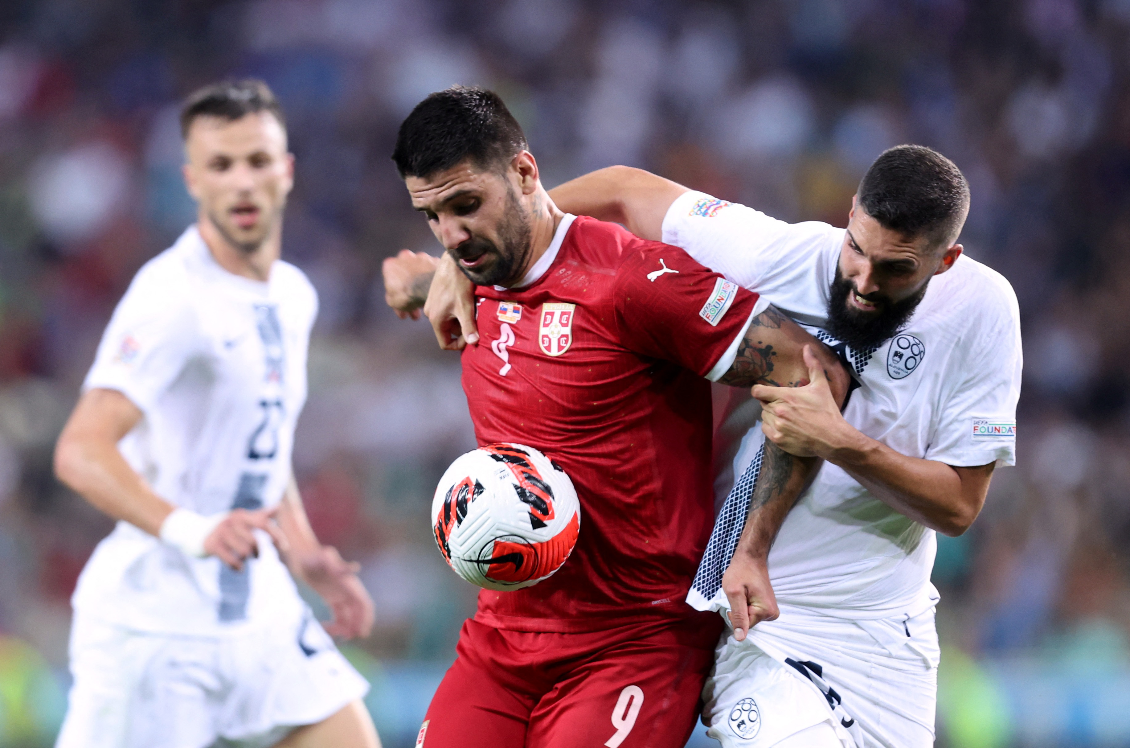 Soccer Football - UEFA Nations League - Group H - Slovenia v Serbia - Stozice Stadium, Ljubljana, Slovenia - June 12, Serbia's Aleksandar Mitrovic in action with Slovenia's Miha Mevlja REUTERS/Borut Zivulovic