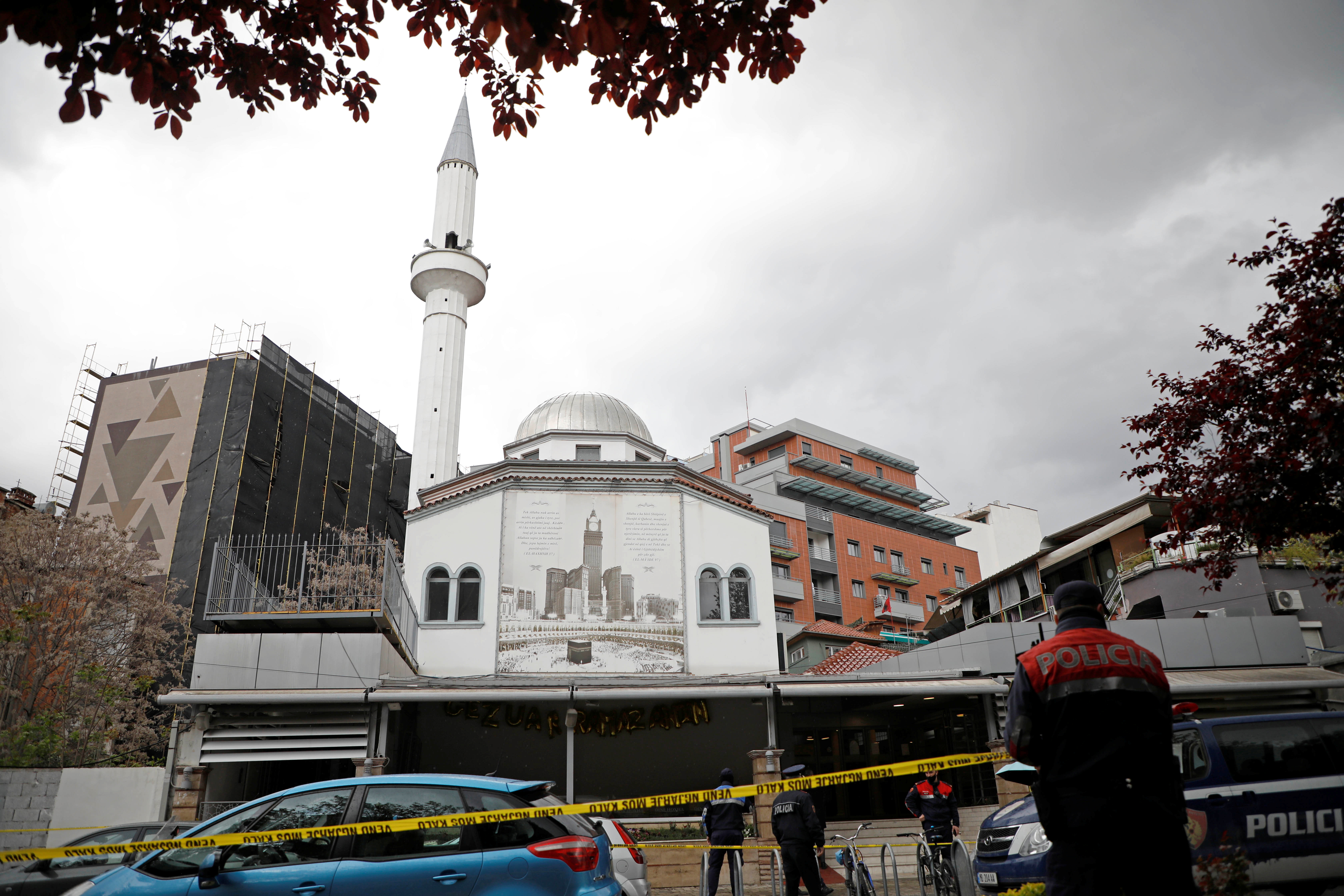 Albanian police officers secure the area near Dine Hoxha mosque after a knife attack, in Tirana