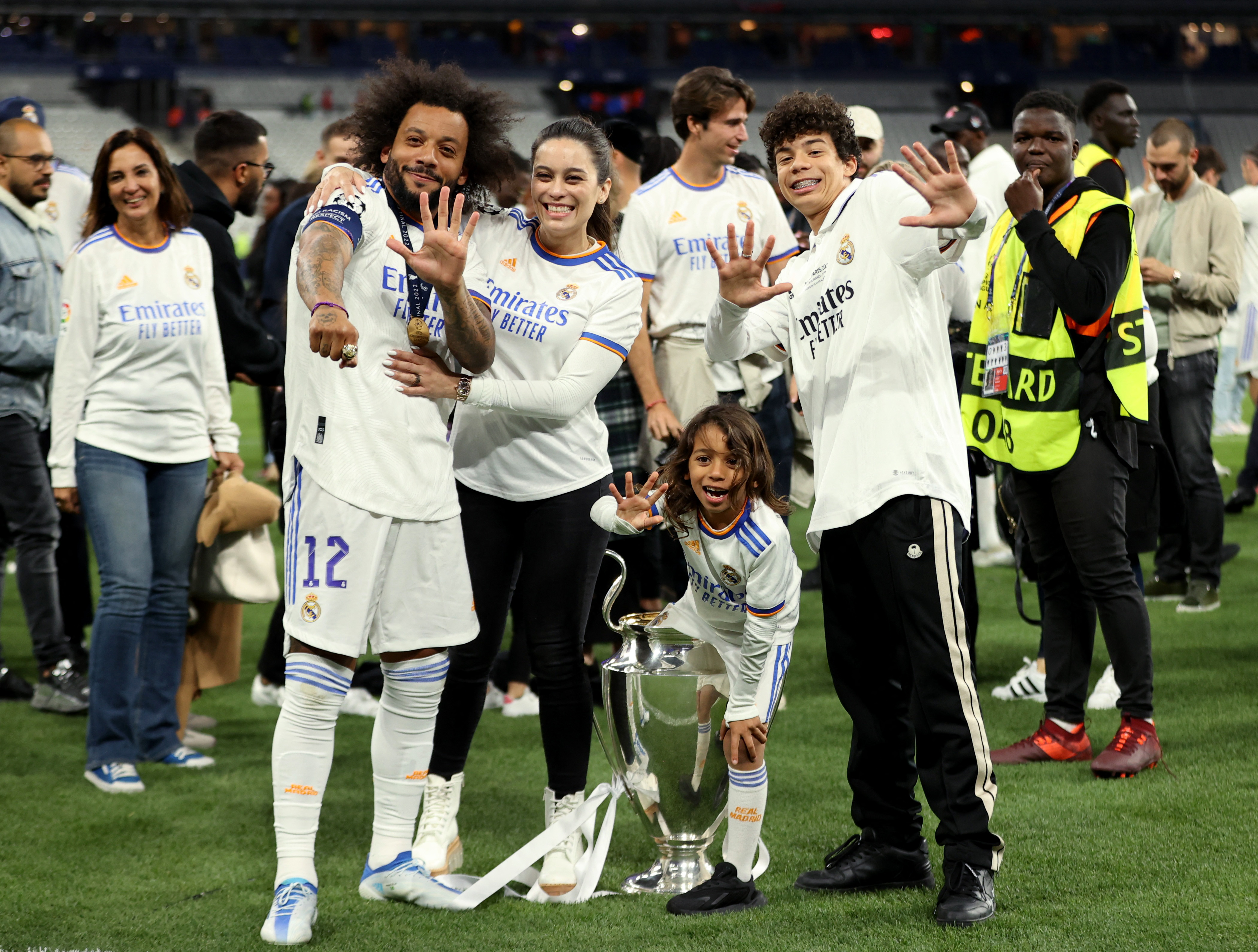 Soccer Football - Champions League Final - Liverpool v Real Madrid - Stade de France, Saint-Denis near Paris, France - May 28, 2022 Real Madrid's Marcelo celebrates with the trophy and his family after winning the Champions League REUTERS/Molly Darlington