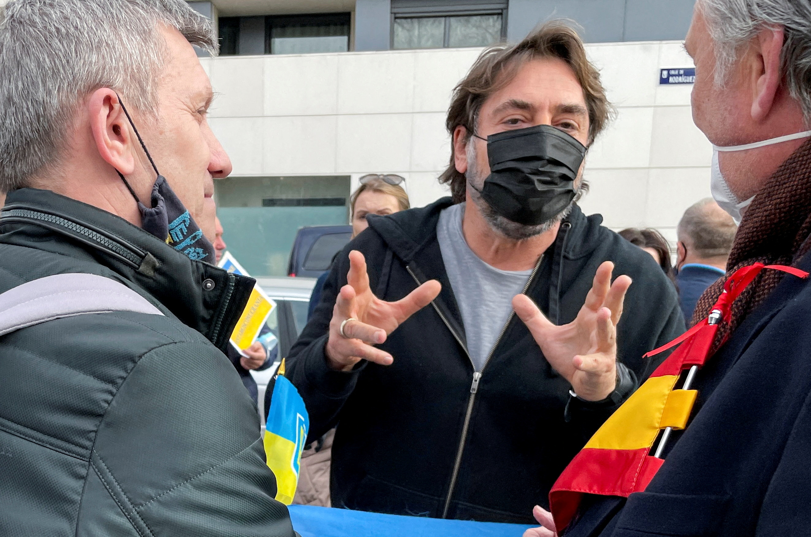 Spanish actor Javier Bardem and Ukrainians attend a protest in front of the Russian Embassy, after Russian President Vladimir Putin authorised a military operation in eastern Ukraine, in Madrid, Spain, February 24, 2022. REUTERS/Guillermo Martinez