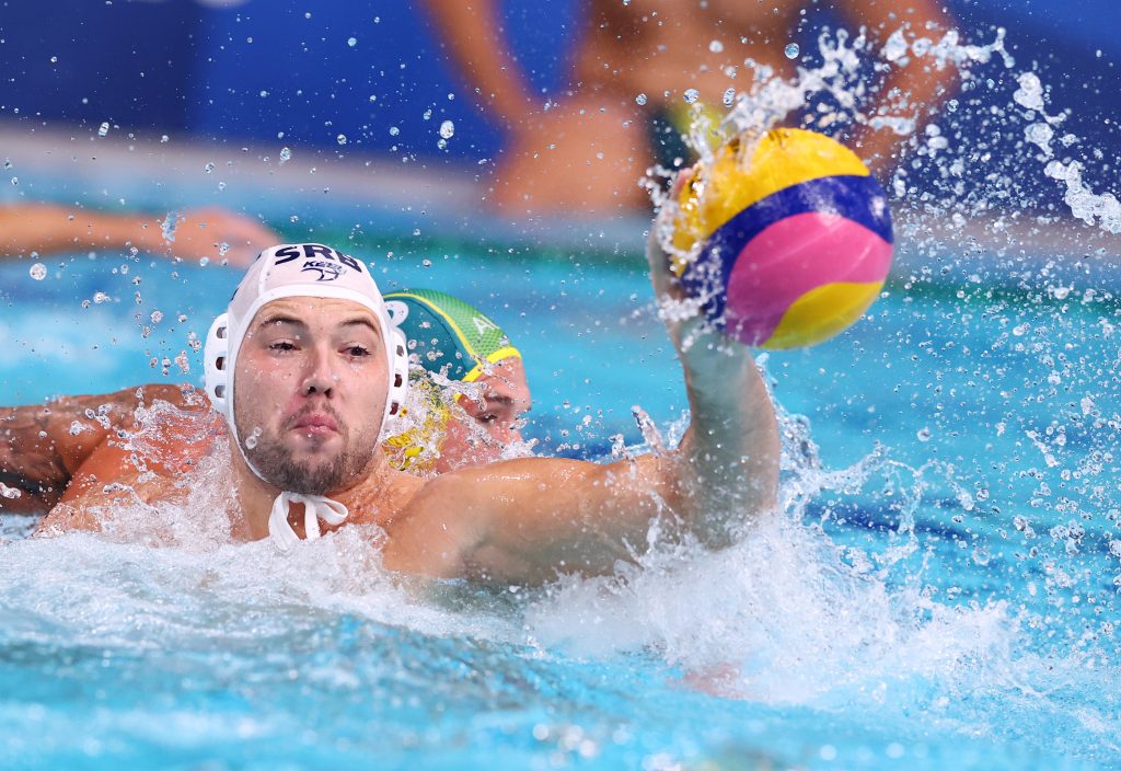 Tokyo 2020 Olympics - Water Polo - Men - Group B - Serbia v Australia - Tatsumi Water Polo Centre, Tokyo, Japan – July 29, 2021. Dusan Mandic of Serbia in action against Aaron Younger of Australia. REUTERS/Kacper Pempel