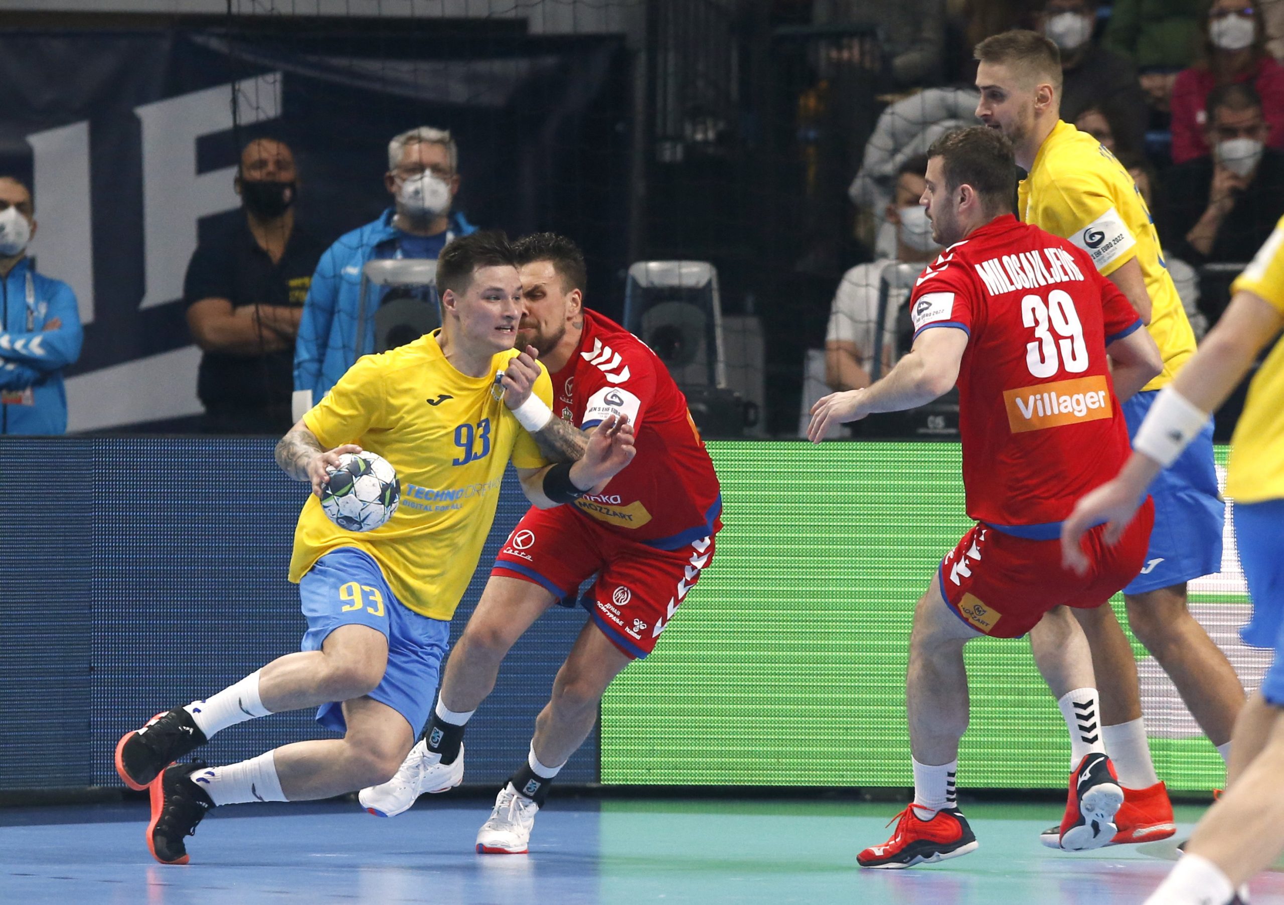 Handball - EHF 2022 Men's European Handball Championship - Group C - Serbia v Ukraine - PICK Arena, Szeged, Hungary - January 13, 2022 Ukraine's Dmytro Artemenko in action with Serbia's Vladimir Cupara REUTERS/Ognen Teofilovski