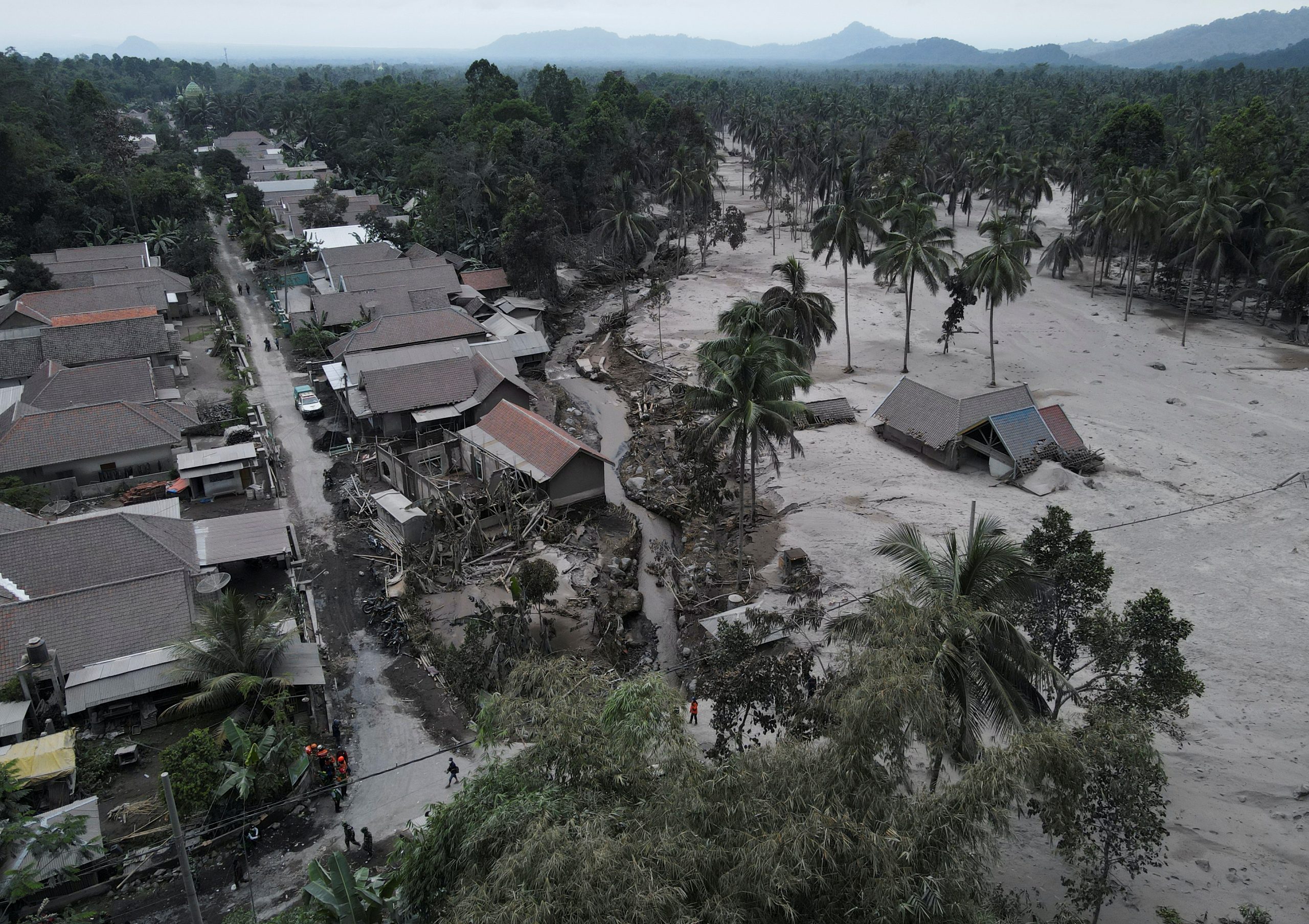 An aerial view of the damaged houses in Sumber Wuluh village that got affected by the eruption of Mount Semeru volcano in Lumajang regency, East Java province, Indonesia, December 5, 2021. Picture taken with a drone. REUTERS/Willy Kurniawan