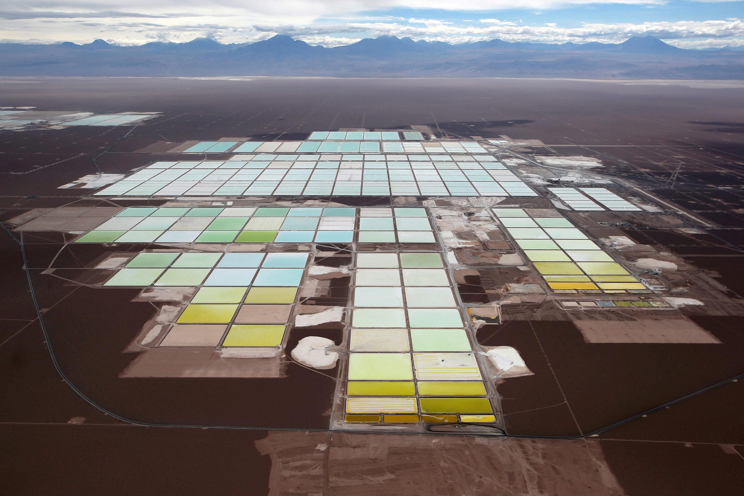 FILE PHOTO: An aerial view shows the brine pools and processing areas of the Soquimich (SQM) lithium mine on the Atacama salt flat in the Atacama desert of northern Chile, January 10, 2013.REUTERS/Ivan Alvarado/File Photo