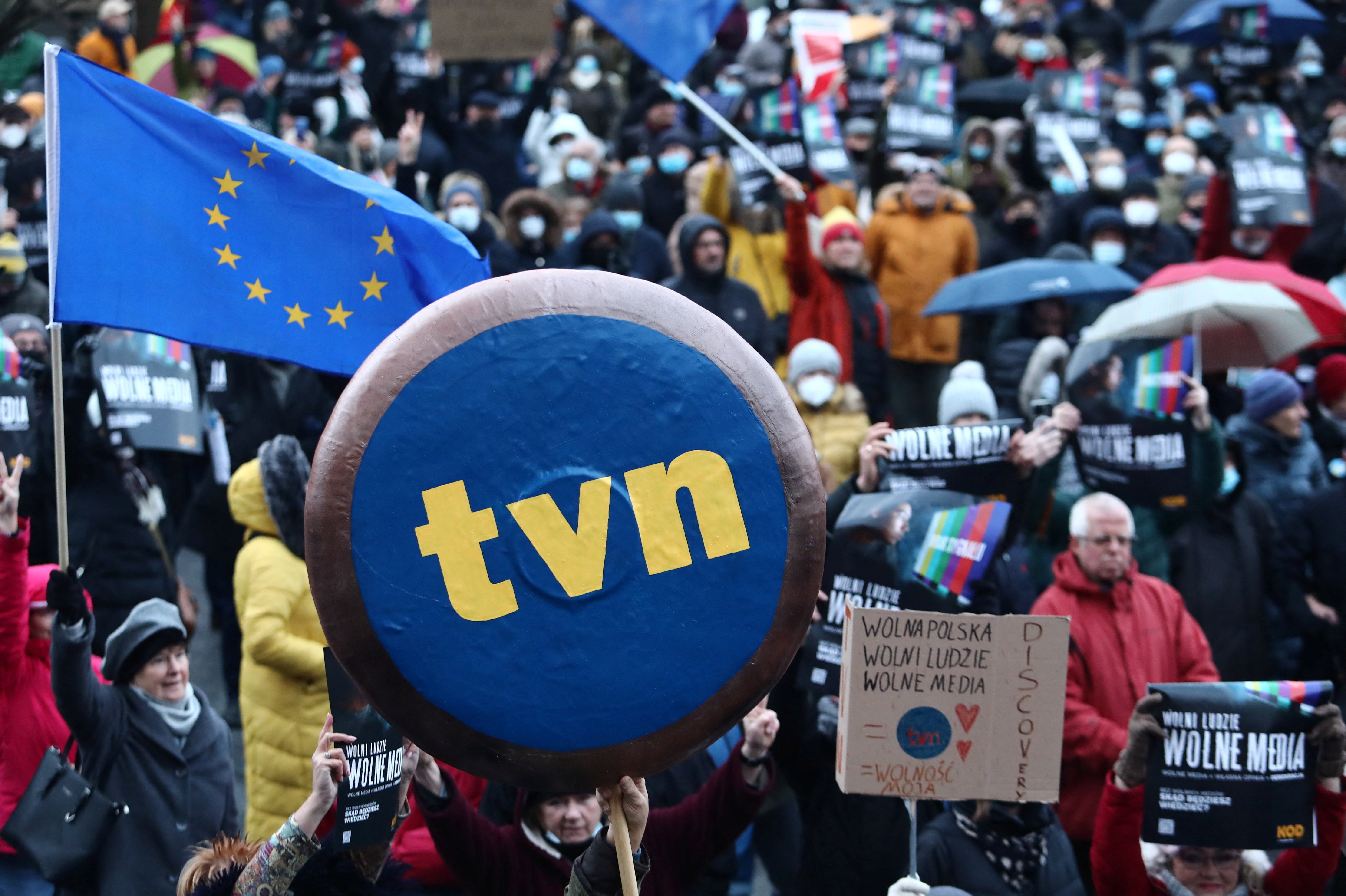 People protest against media law affecting U.S.-owned news channel in Krakow
