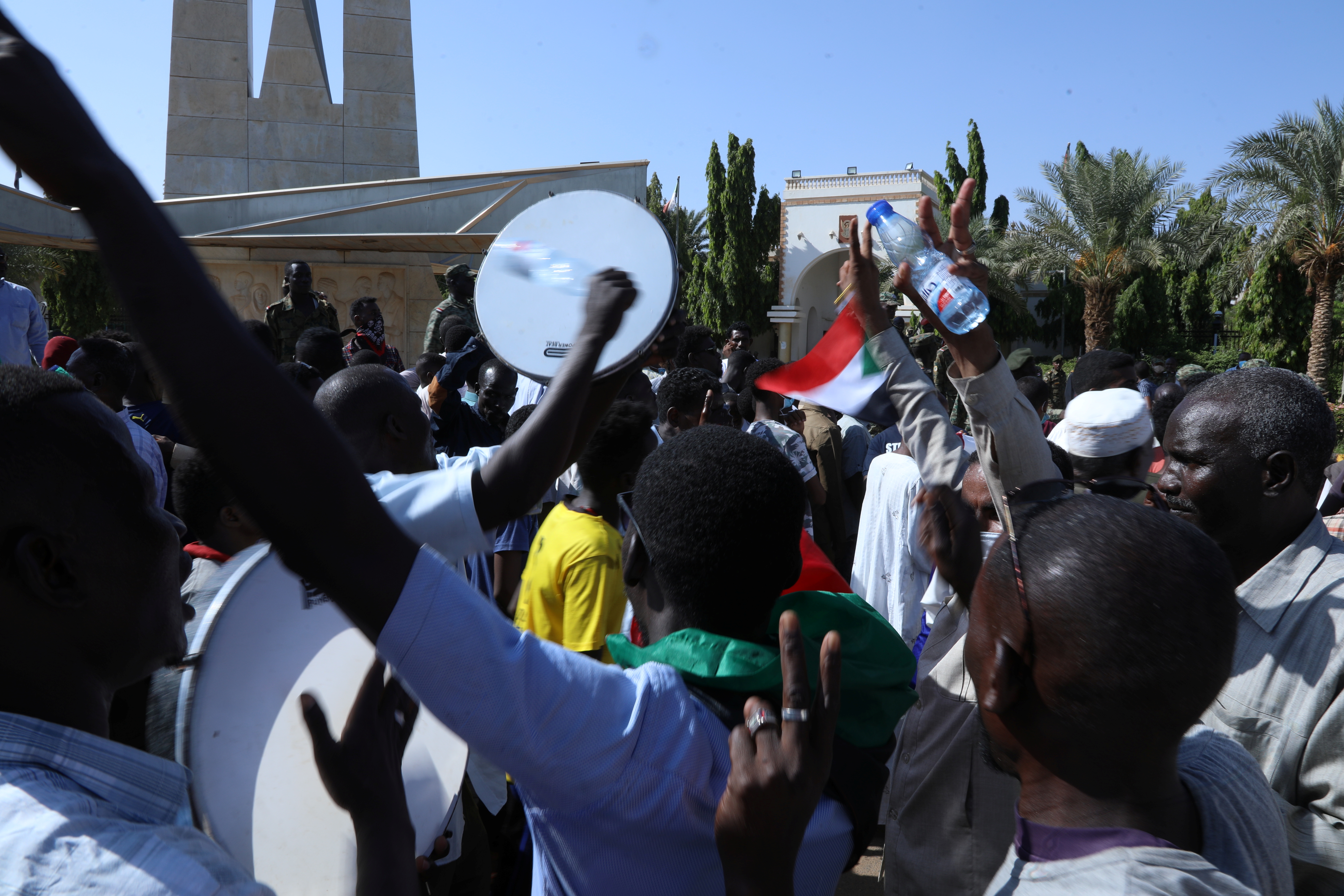 Military-aligned demonstrators gathered in numbers, chant "Down with the government of hunger" in front of the Presidential palace in Khartoum, Sudan, October 16, 2021. REUTERS/El Tayeb Siddig