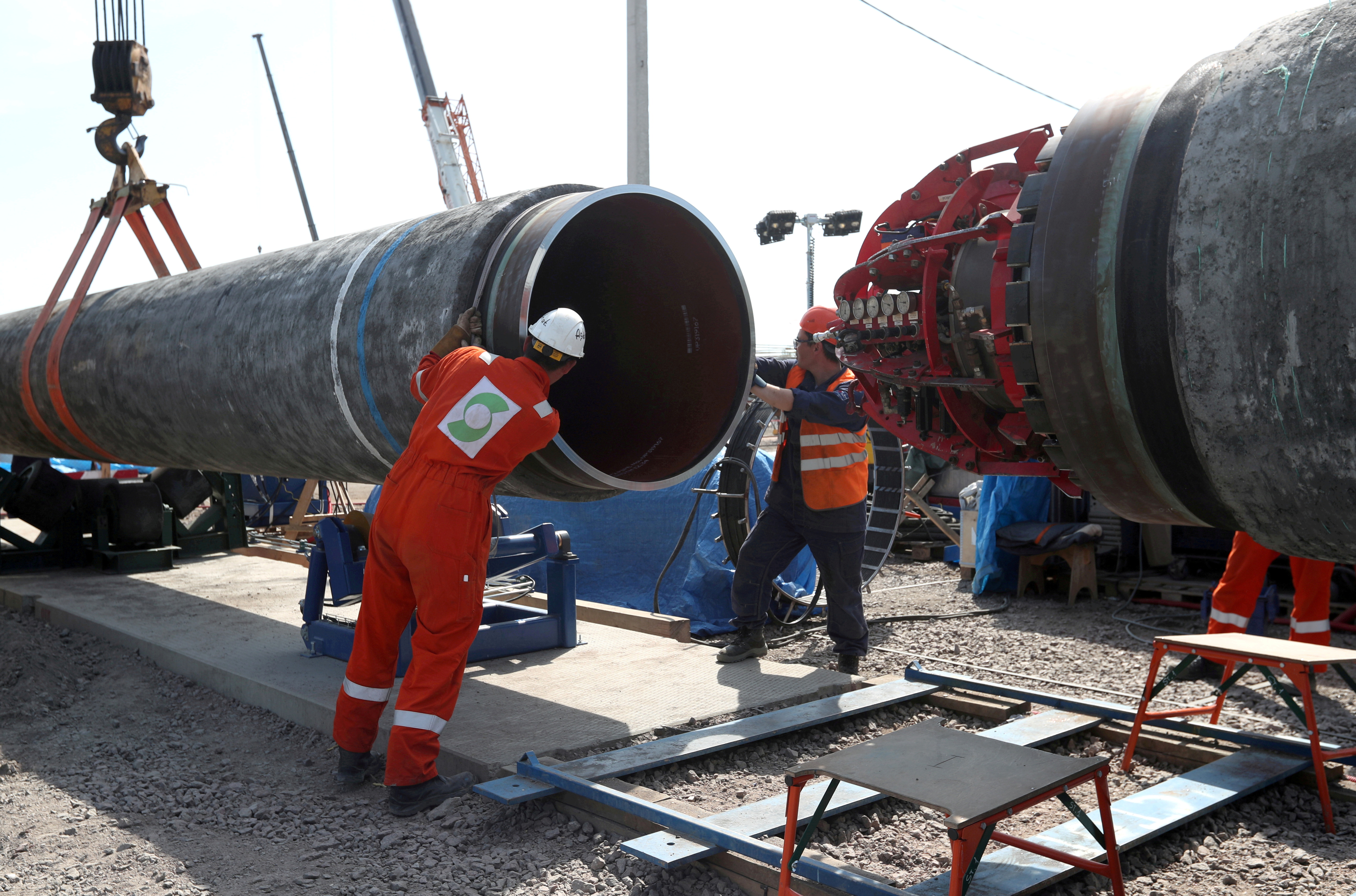FILE PHOTO: Workers at the construction site of the Nord Stream 2 gas pipeline in Russia