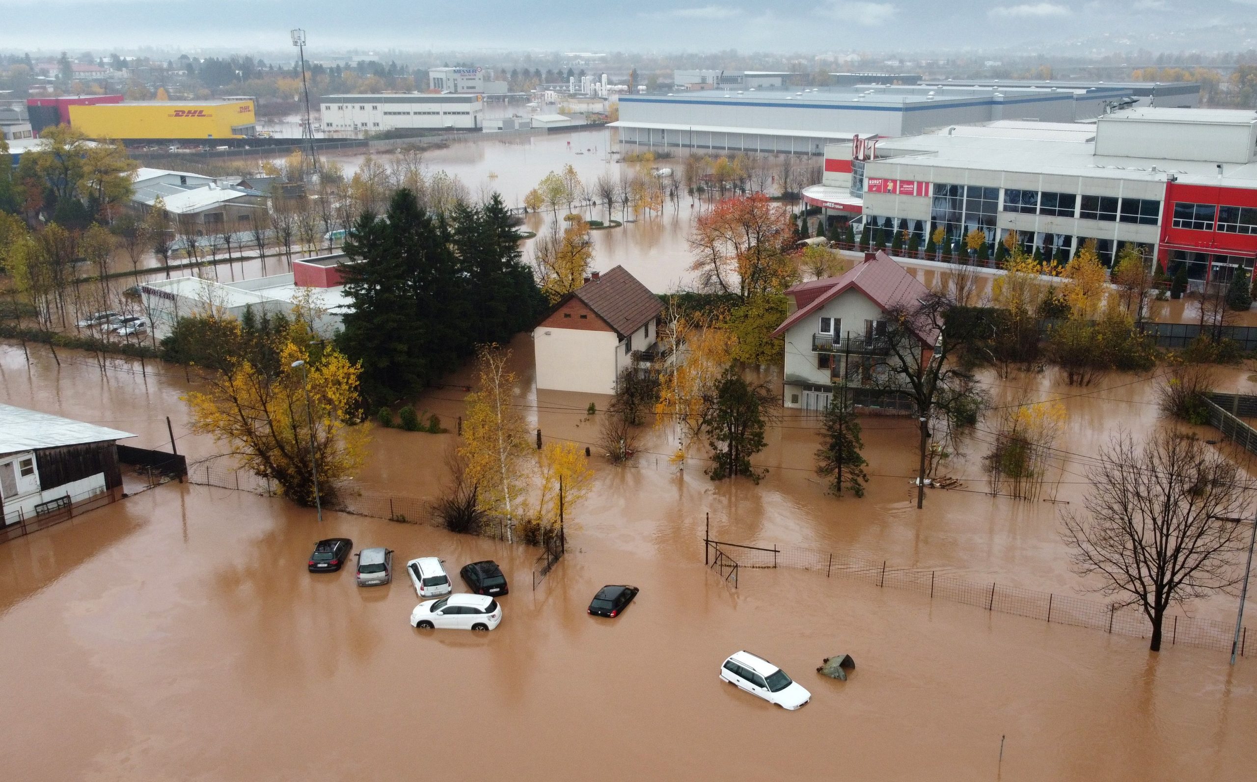 An aerial picture shows a flooded home and cars in Rajlovac near Sarajevo, Bosnia and Herzegovina November 5, 2021. Picture taken with a drone. REUTERS/Dado Ruvic
