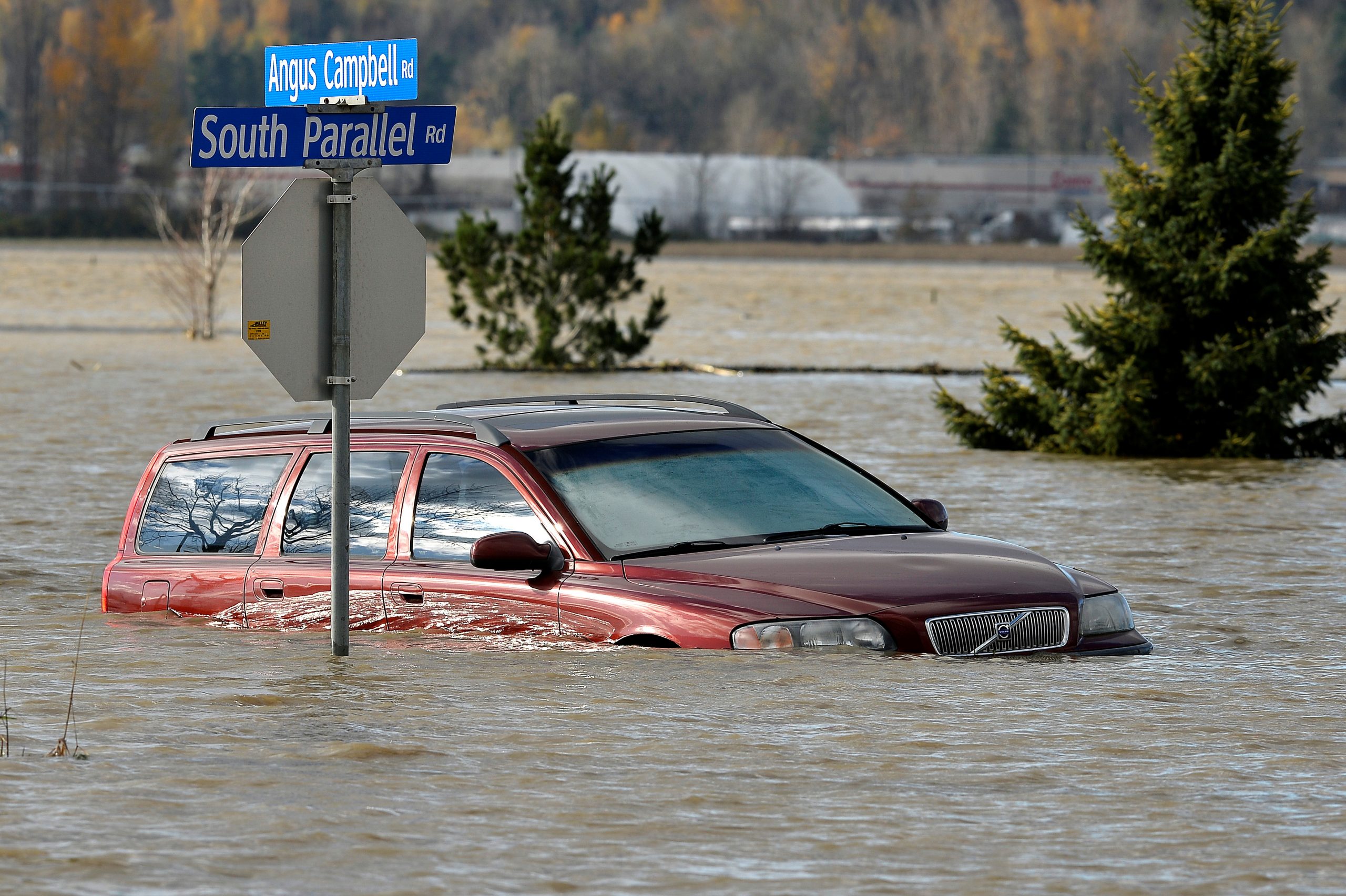 A vehicle is submerged in water after rainstorms caused flooding and landslides in Abbotsford, British Columbia, Canada November 16, 2021.  REUTERS/Jennifer Gauthier