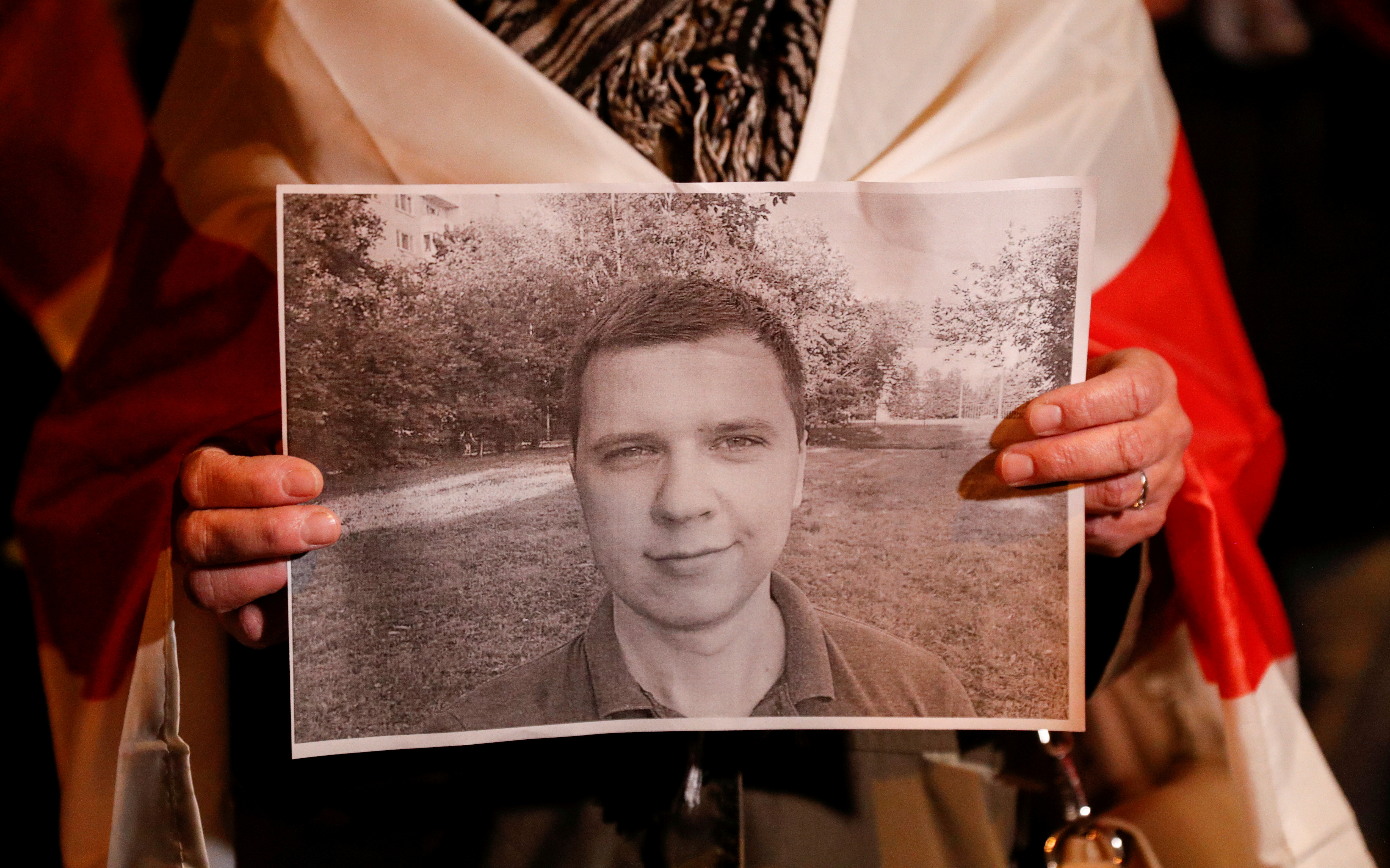 FILE PHOTO: A participant holds a portrait of IT worker Andrei Zeltser in Kyiv