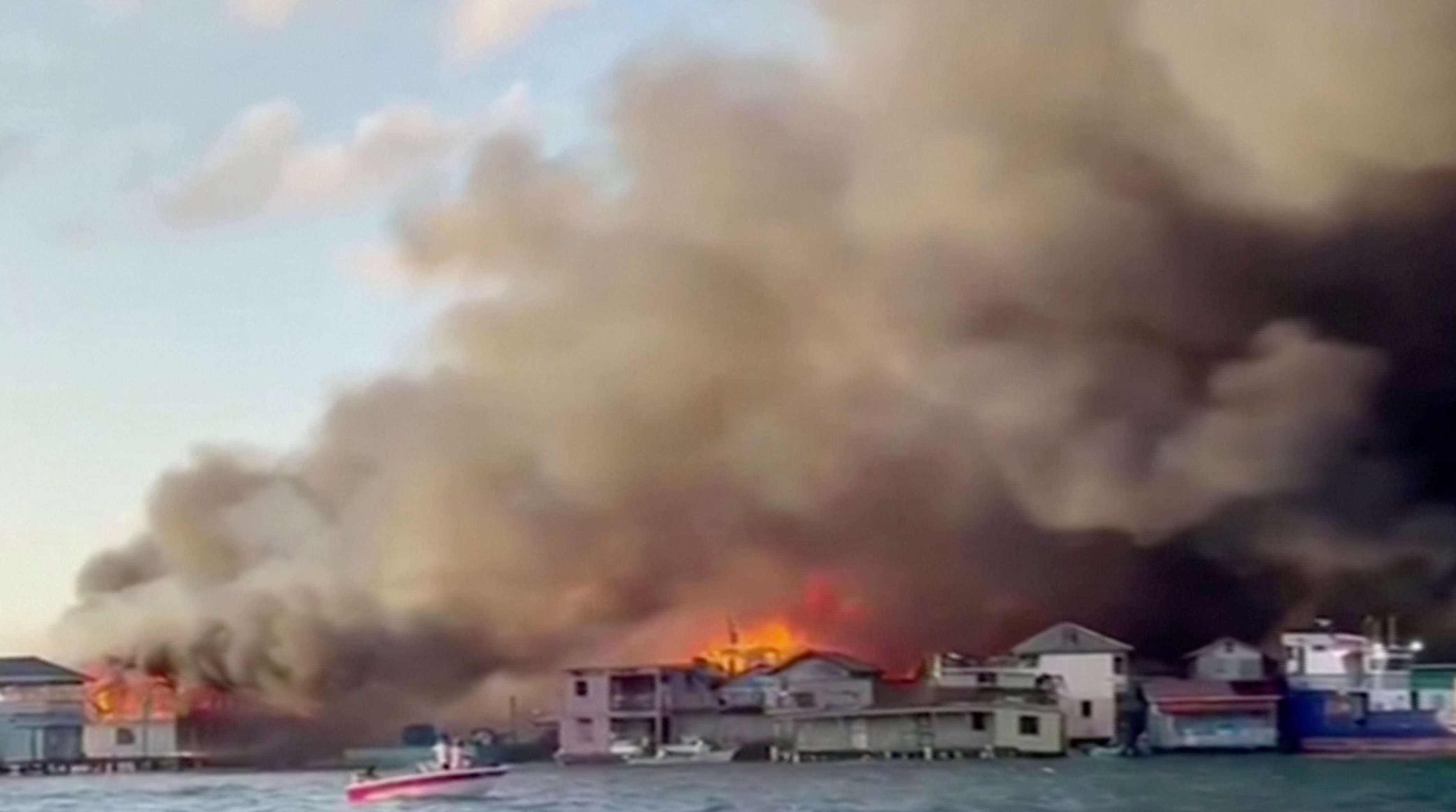 Smoke billows from a fire at a residential area on the island of Guanaja