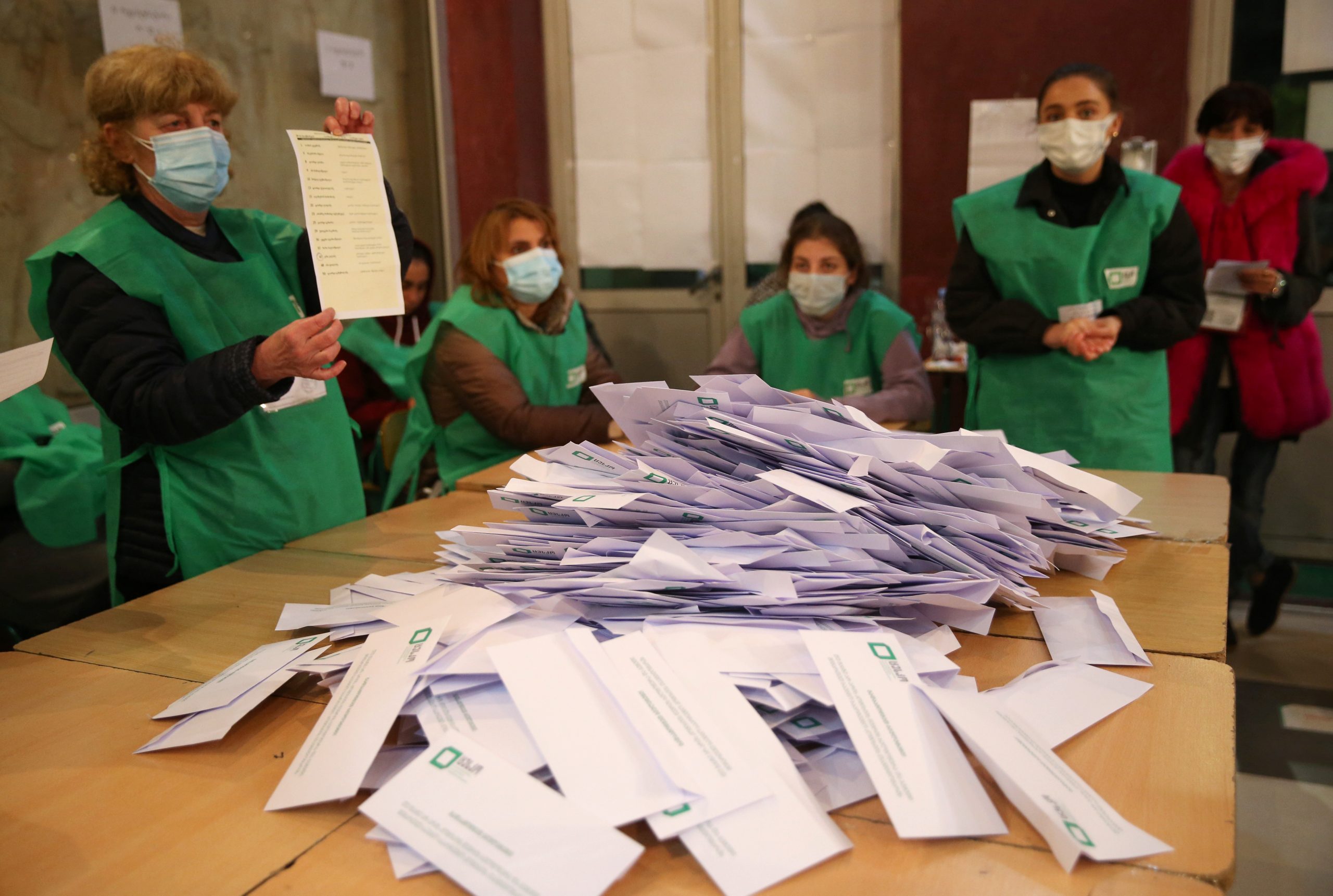 Members of a local election commission count votes after polls closed during the municipal elections in Tbilisi, Georgia October 2, 2021. REUTERS/Irakli Gedenidze
