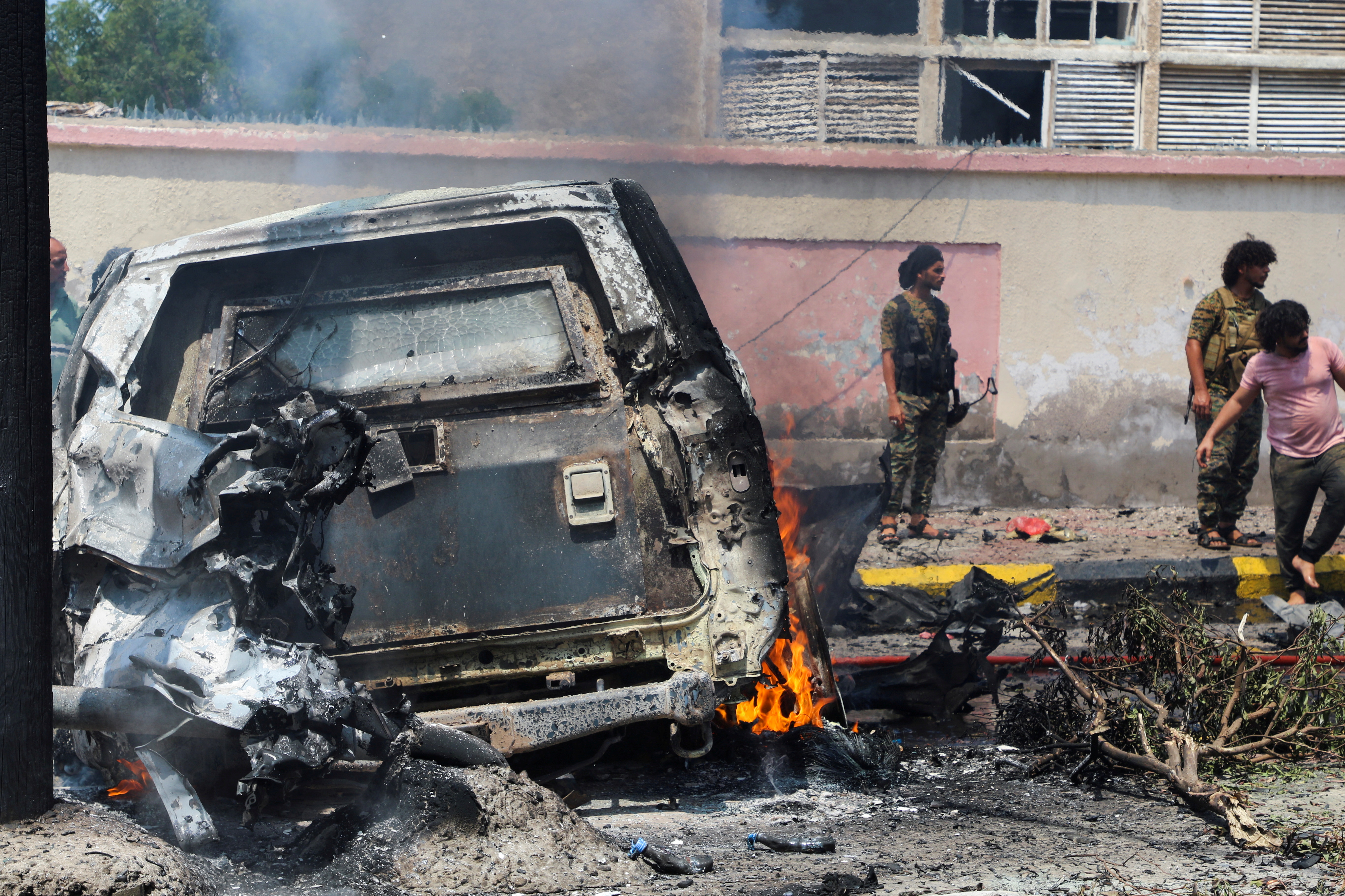 Policemen stand at the scene of a blast in Aden, Yemen, October 10, 2021. REUTERS/Fawaz Salman     TPX IMAGES OF THE DAY