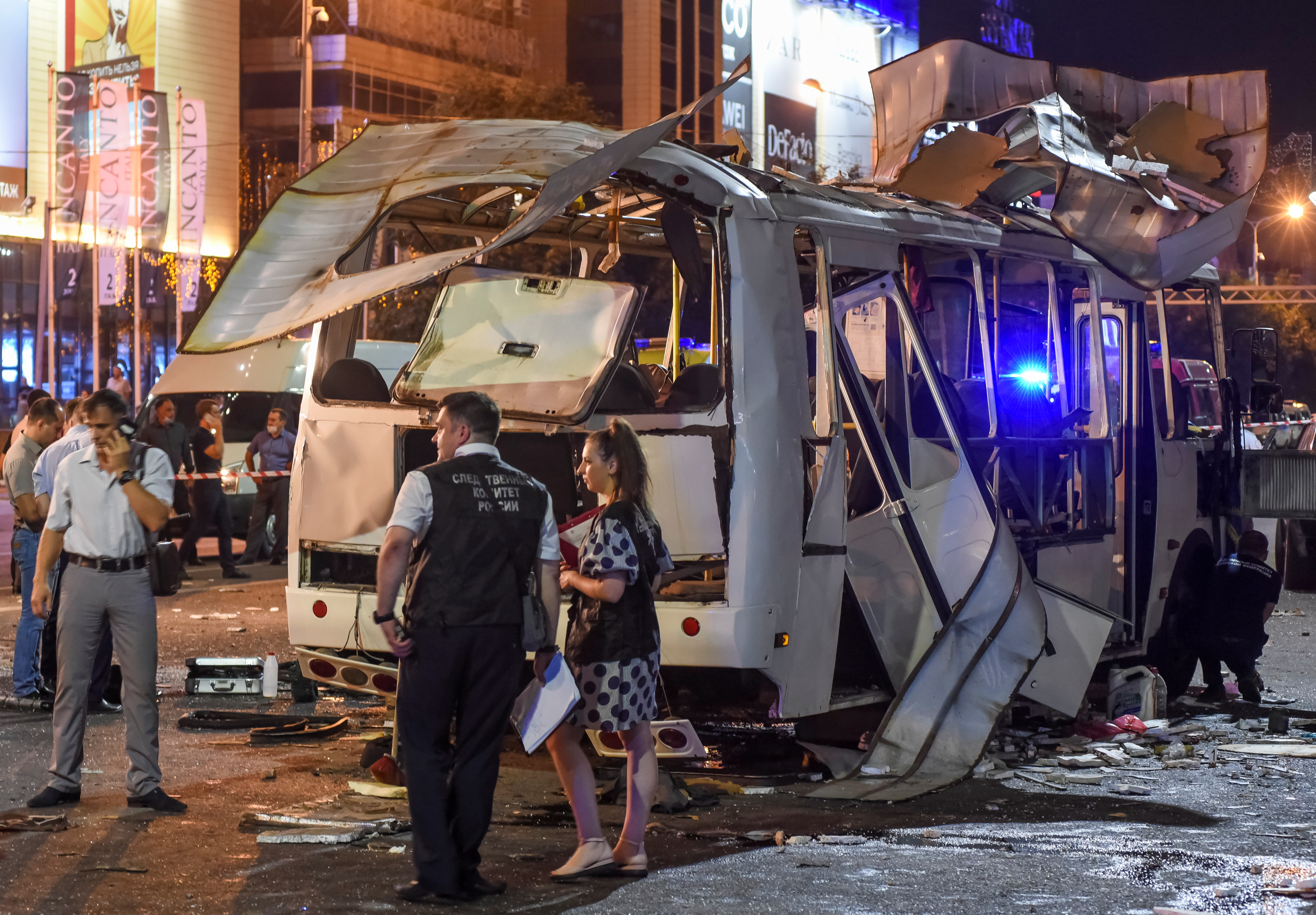 Investigators work at a site of a bus explosion in the city of Voronezh, Russia August 12, 2021. Picture taken August 12, 2021.  REUTERS/Vladimir Lavrov NO RESALES. NO ARCHIVES