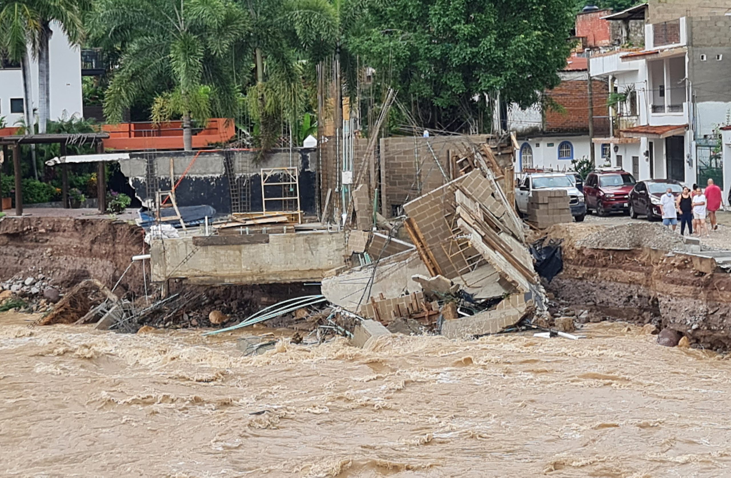 A view shows swollen Cuale river waters after that Hurricane Nora pounds Mexico coast with heavy rains and strong winds in Puerto Vallarta, in Jalisco state, Mexico August 29, 2021. REUTERS/Alfonso Lepe NO RESALES. NO ARCHIVES