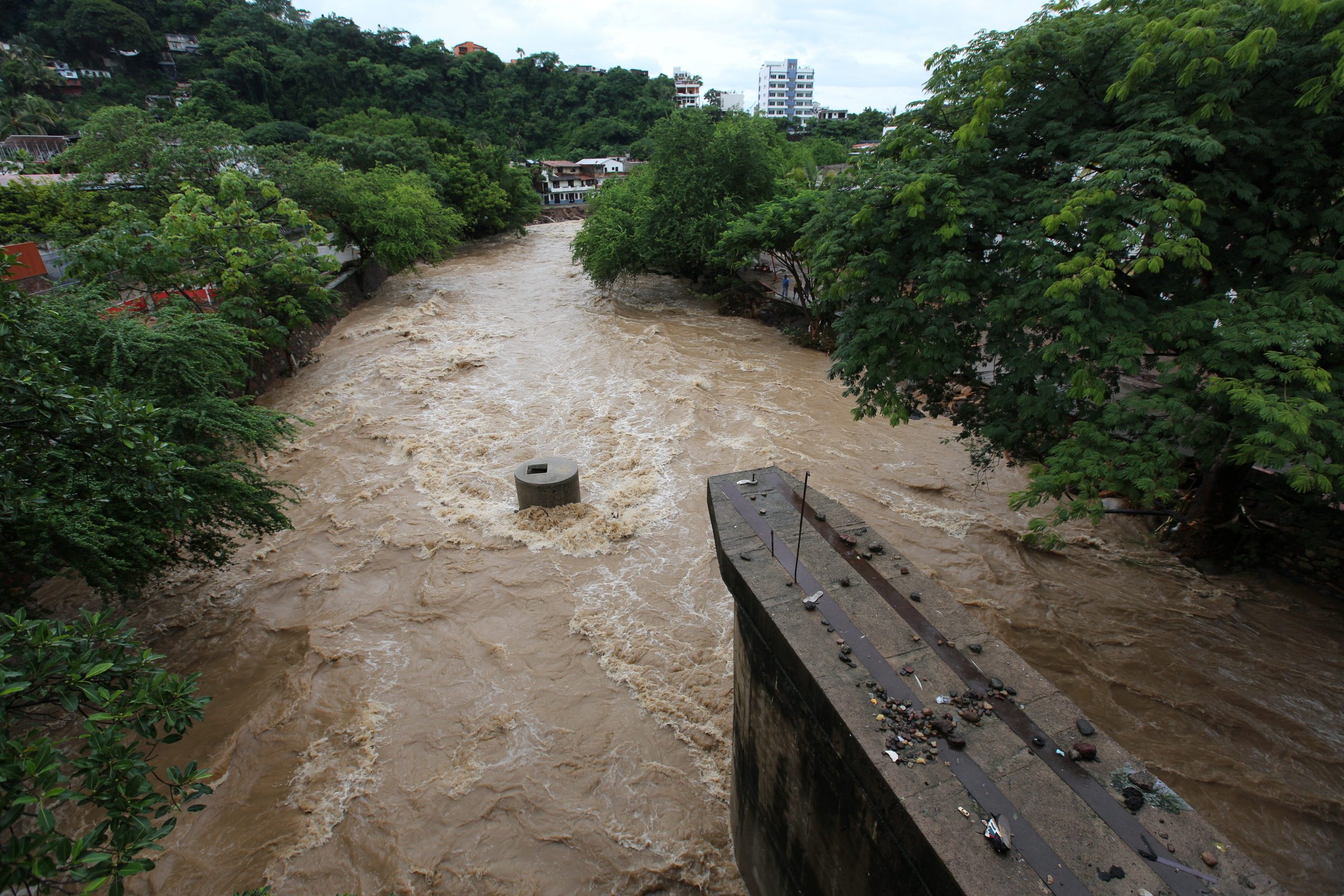A view shows swollen Cuale river waters after that Hurricane Nora pounds Mexico coast with heavy rains and strong winds in Puerto Vallarta, in Jalisco state, Mexico August 29, 2021. REUTERS/Alfonso Lepe NO RESALES. NO ARCHIVES