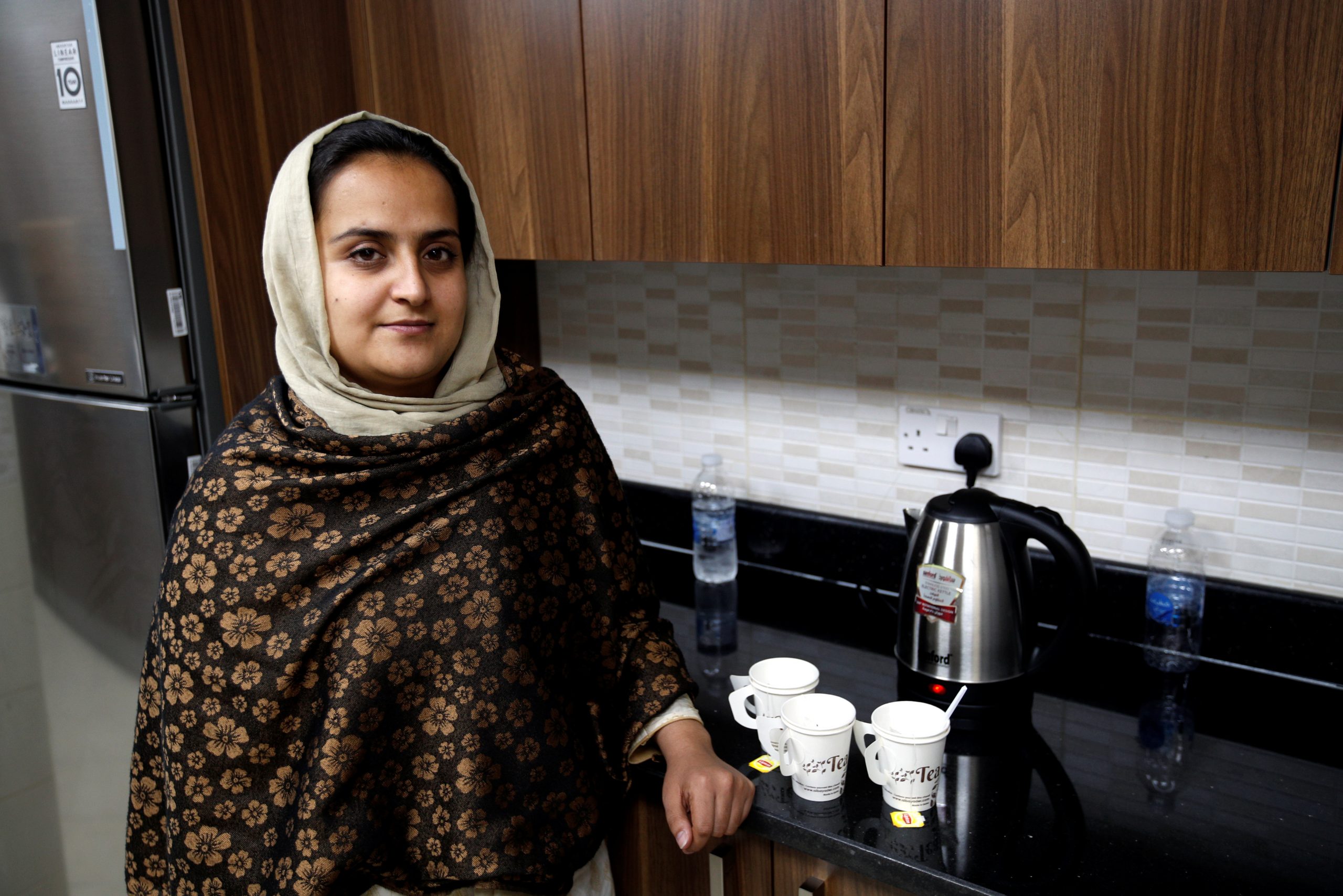 Afghan news anchor Beheshta Arghand poses for photo as she makes her afternoon tea at a temporary residence compound in Doha, Qatar, September 1, 2021. REUTERS/Hamad I Mohammed