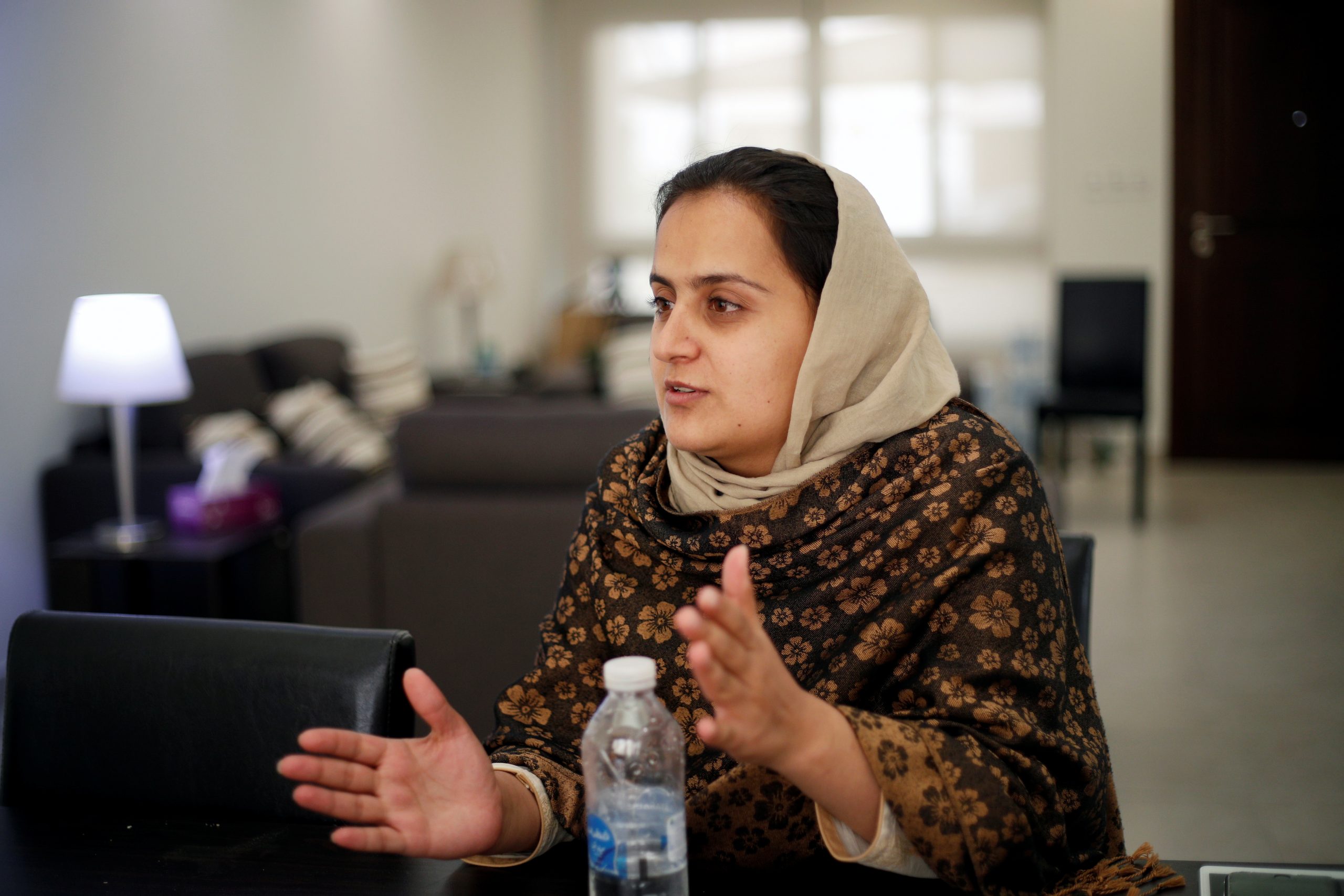 Afghan news anchor Beheshta Arghand speaks to her brother at a temporary residence compound in Doha, Qatar, September 1, 2021. REUTERS/Hamad I Mohammed