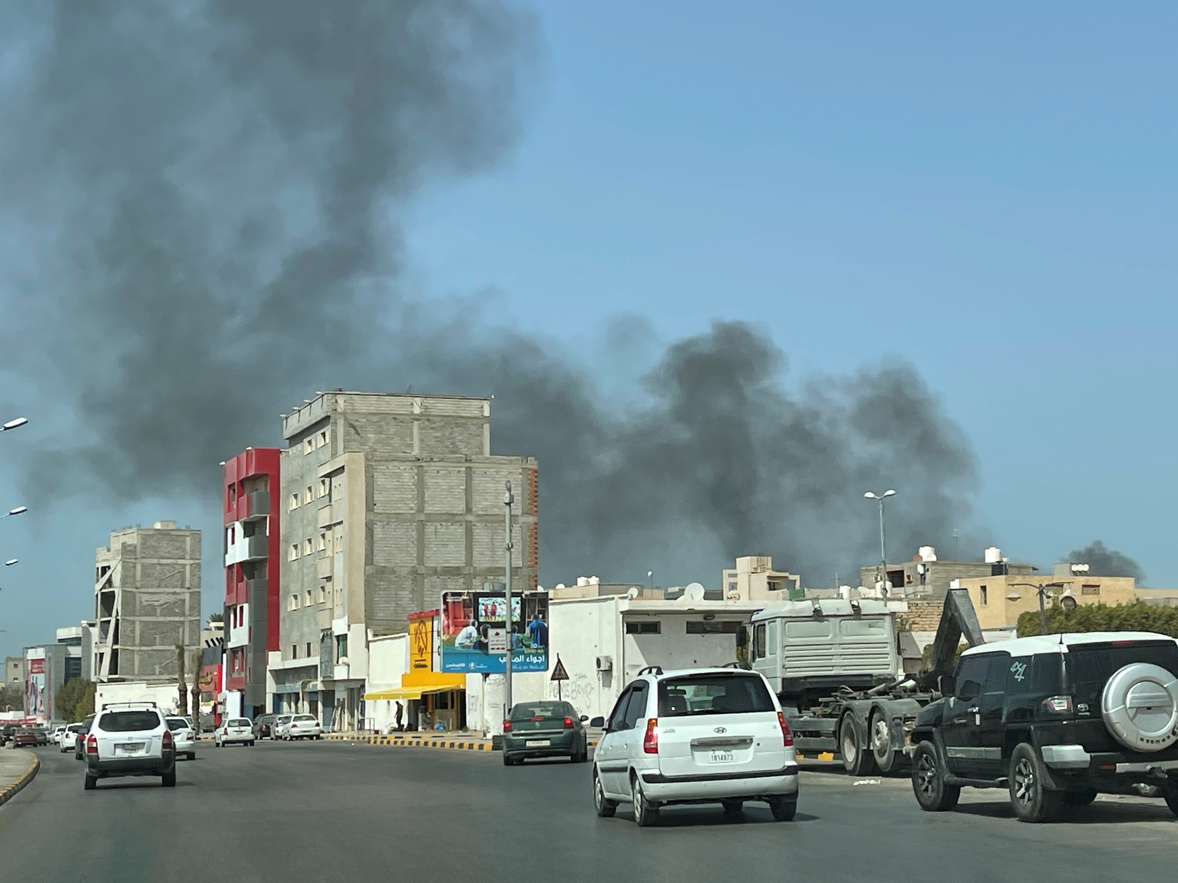 FILE PHOTO: Smoke rises after an attack on Administrative Control Authority in Tripoli