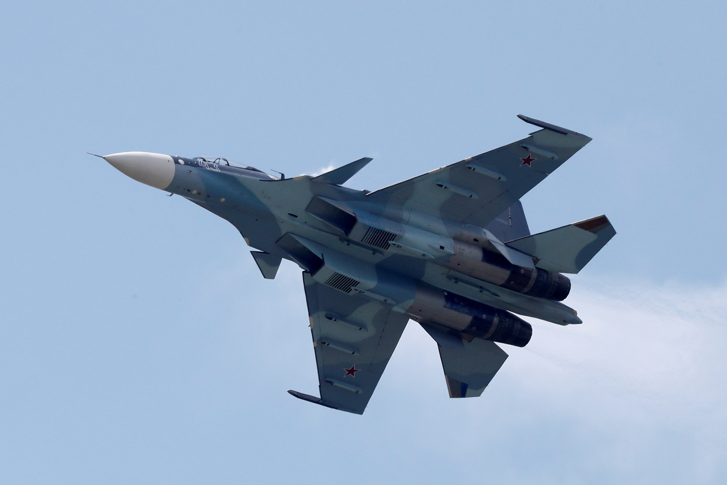 FILE PHOTO: A Sukhoi Su-30SM jet fighter performs during a demonstration flight at the MAKS 2017 air show in Zhukovsky, outside Moscow, Russia, July 21, 2017. REUTERS/Sergei Karpukhin/File Photo