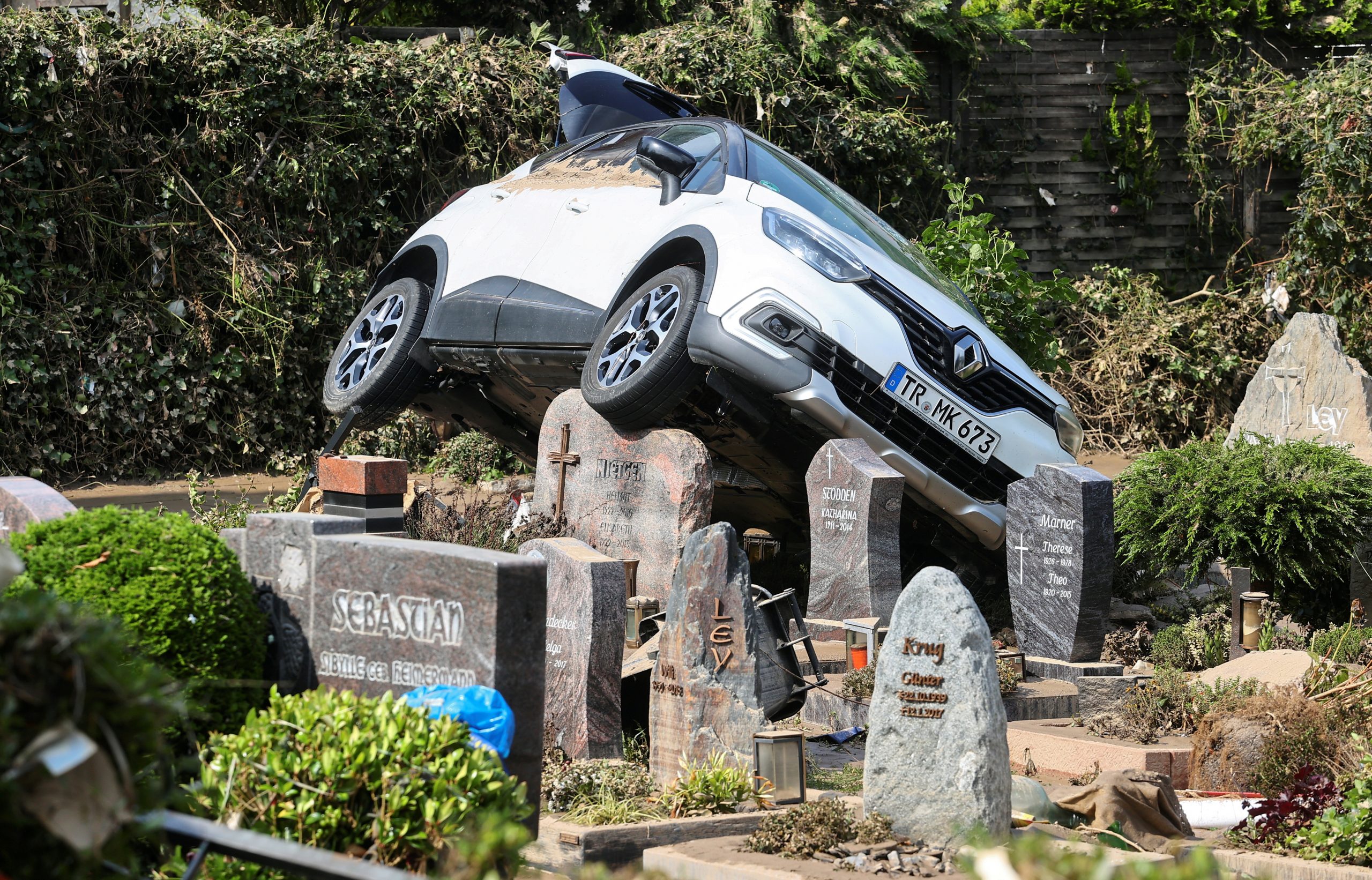 A car is pictured at a cemetary following heavy rainfalls in Dernau, Germany, July 17, 2021. REUTERS/Wolfgang Rattay     TPX IMAGES OF THE DAY