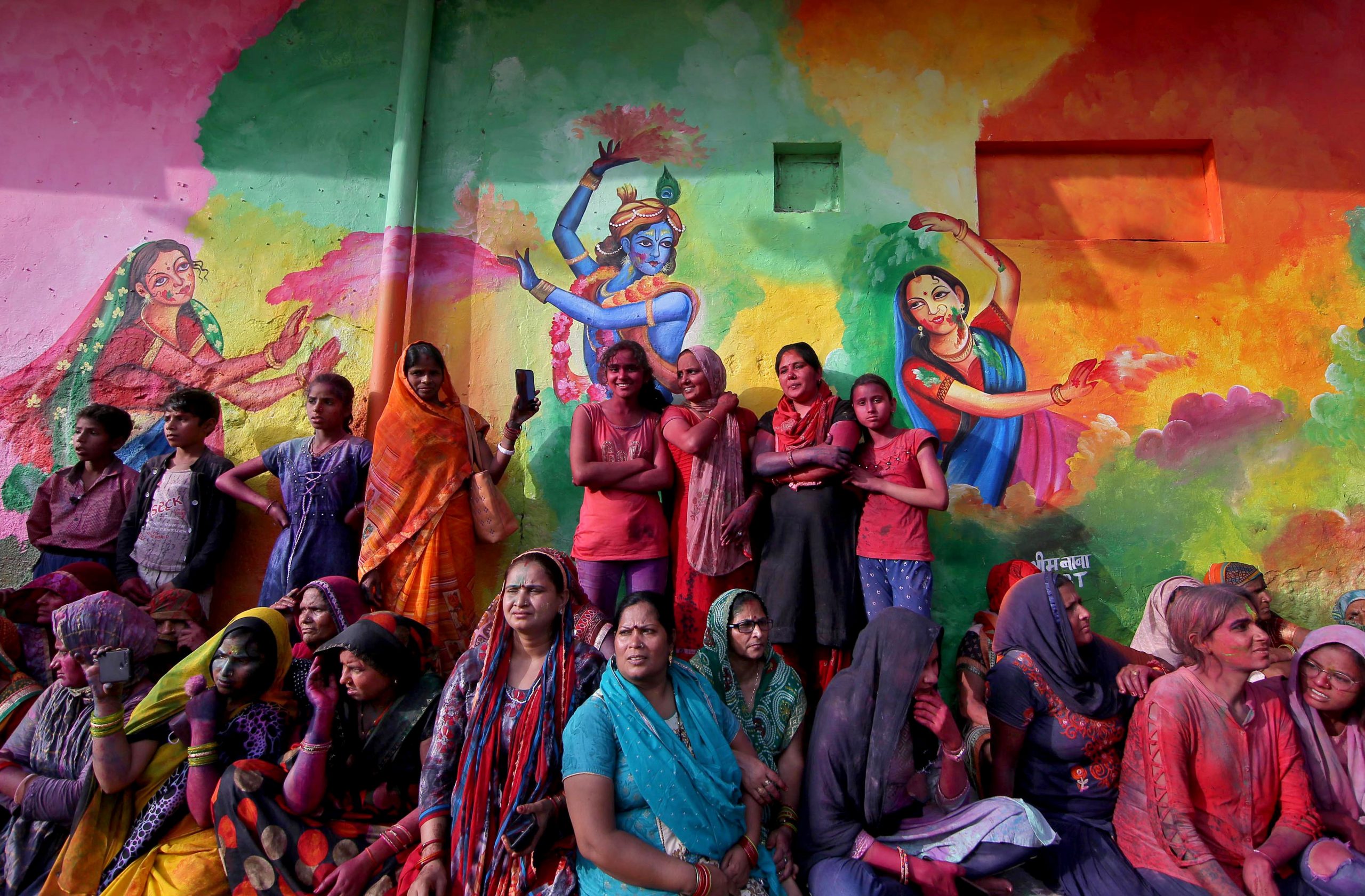 People watch Lathmar Holi celebrations, amidst the spread of the coronavirus disease (COVID-19), in the town of Nandgaon, in the northern state of Uttar Pradesh, India, March 24, 2021. REUTERS/K. K. Arora
