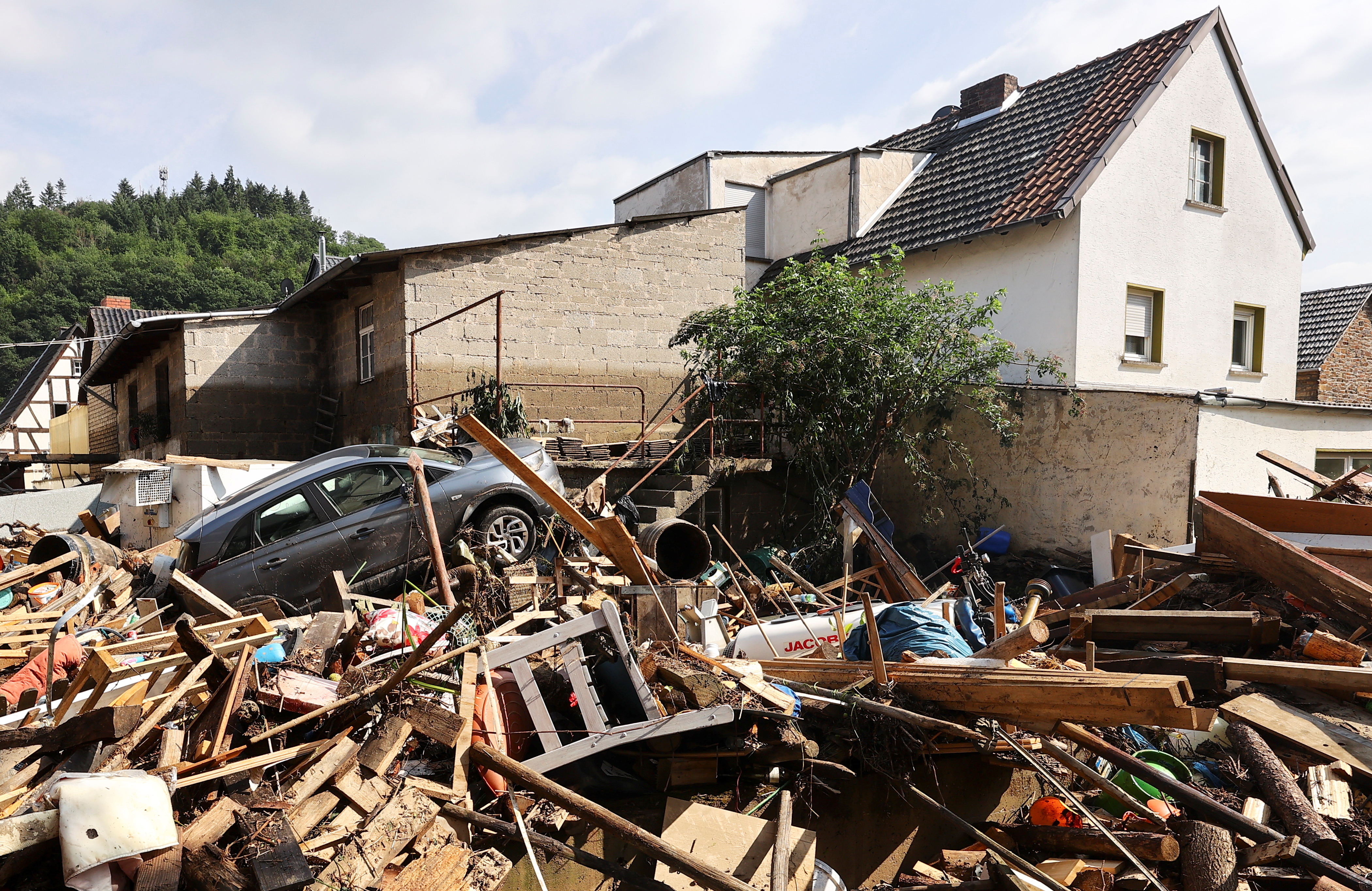 Debris covers residential area following heavy rainfalls in Dernau, Germany, July 17, 2021. REUTERS/Wolfgang Rattay