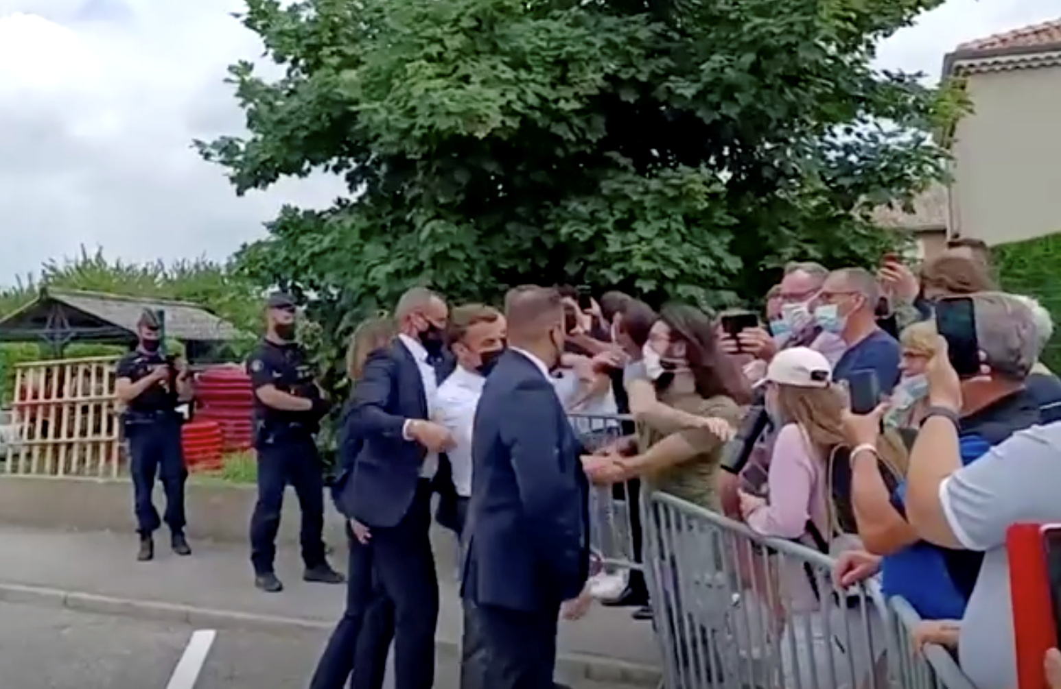 French President Emmanuel Macron gets slapped by a member of the public during a visit in Tain-L'Hermitage