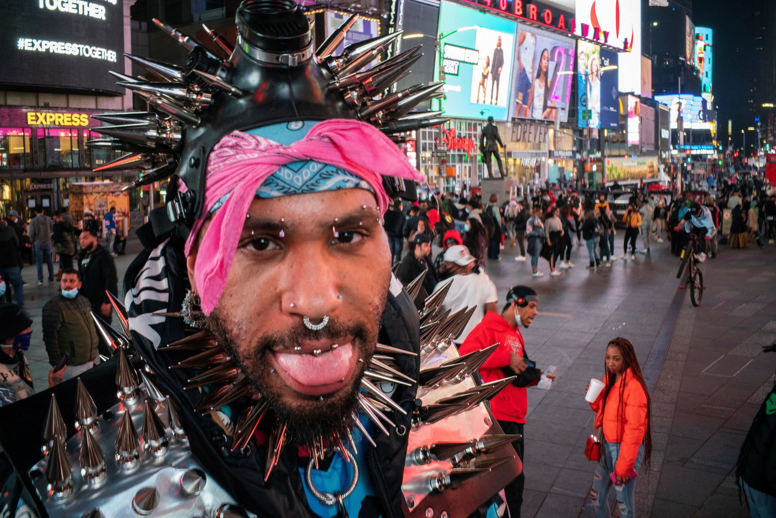 People without face masks are seen at Times Square during the coronavirus disease (COVID-19) pandemic in New York City, U.S., March 11, 2021. REUTERS/Eduardo Munoz