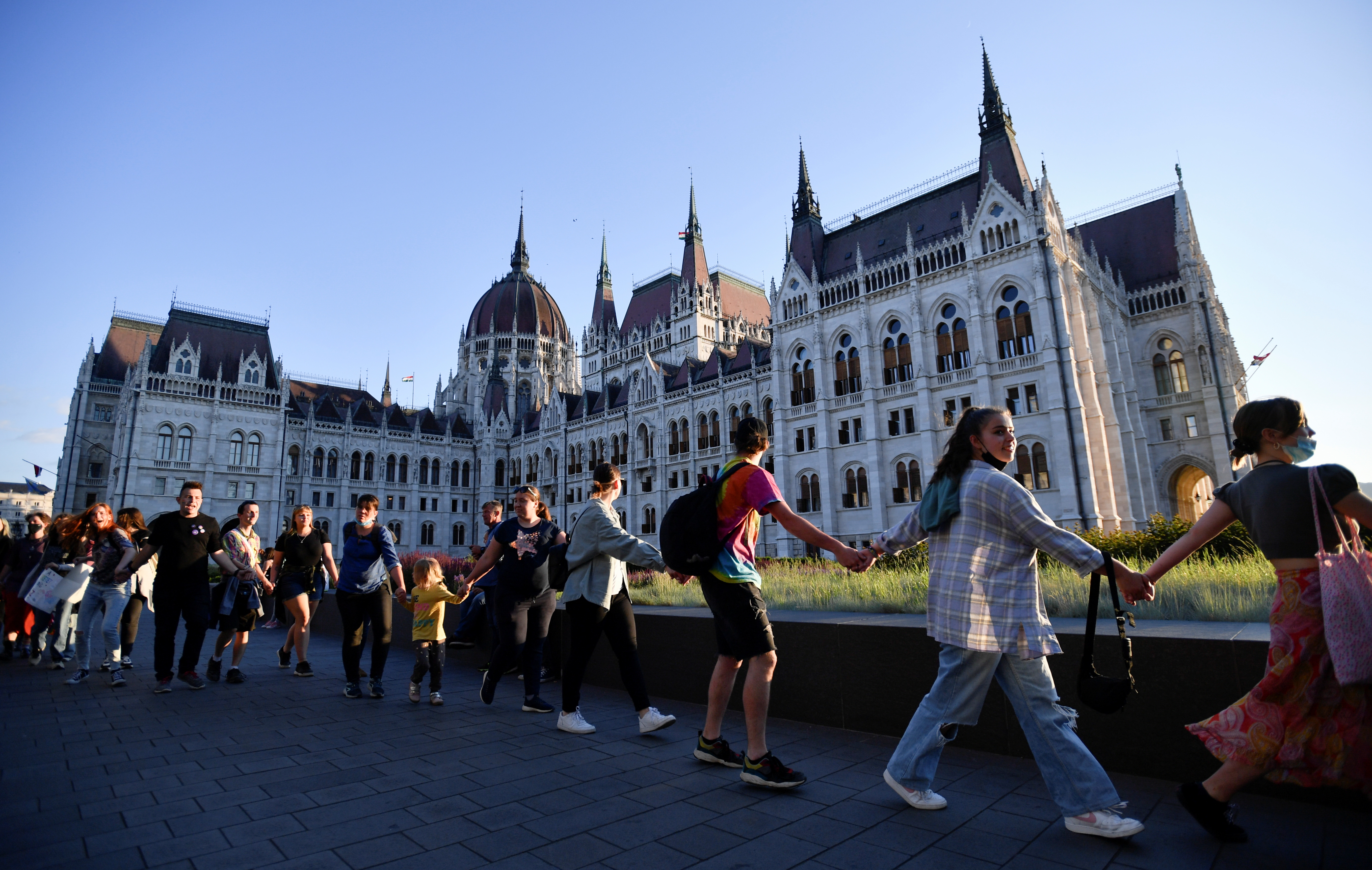 Demonstrators march around the Hungarian parliament as they protest against Hungarian Prime Minister Viktor Orban and the latest anti-LGBTQ law in Budapest, Hungary, June 14, 2021. REUTERS/Marton Monus
