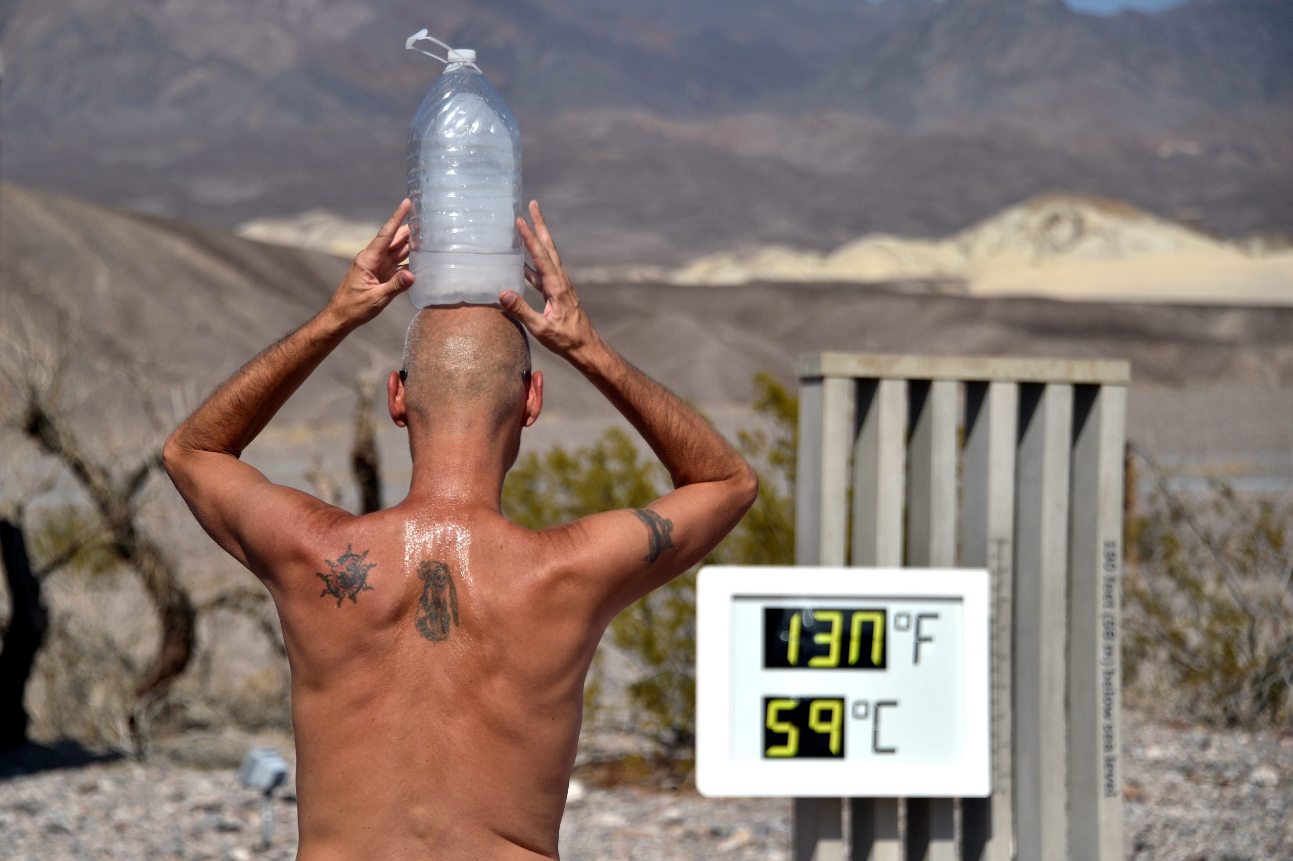 1624108174-2021-05-26T220202Z_452523305_RC2YNN9U3ZRR_RTRMADP_3_CLIMATE-CHANGE-TEMPERATURES-scaled.jpg