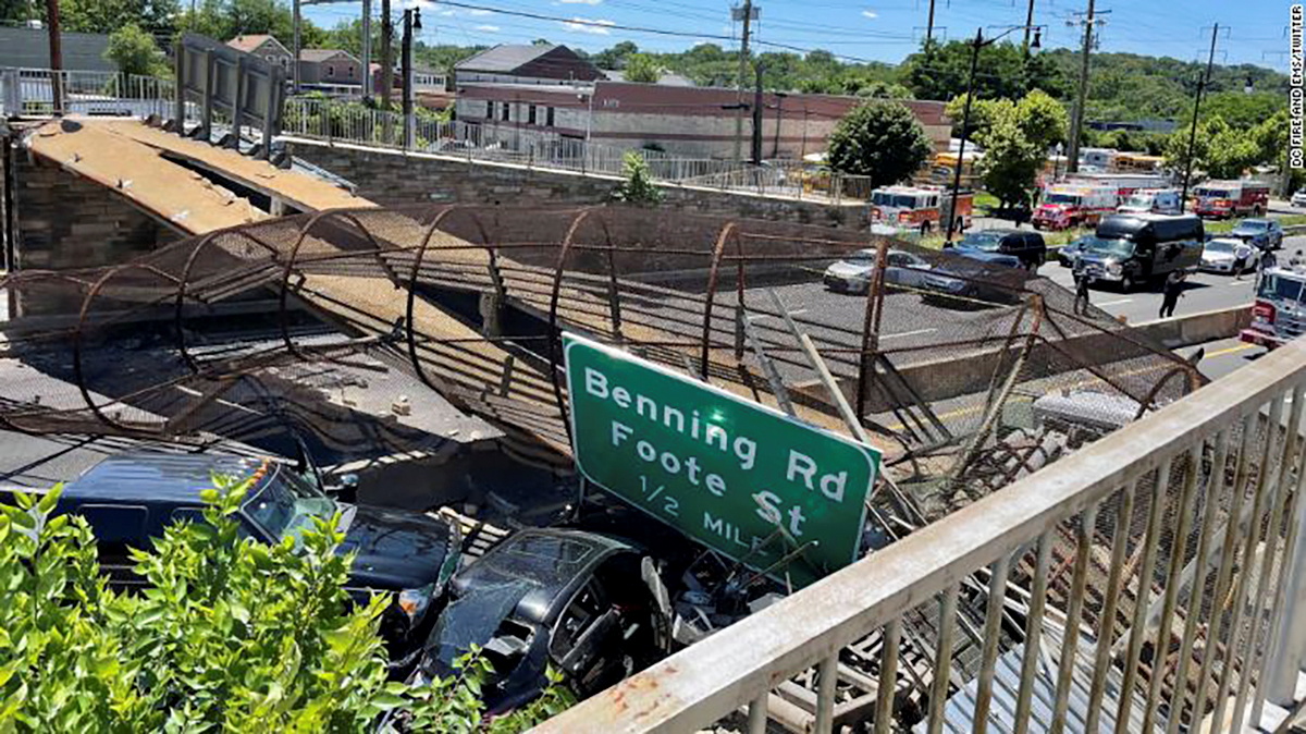 Emergency personnel respond to a crash scene after a pedestrian bridge collapsed onto a roadway in Washington, U.S., June 23, 2021. Vito Maggiolo/DC Fire and EMS via REUTERS