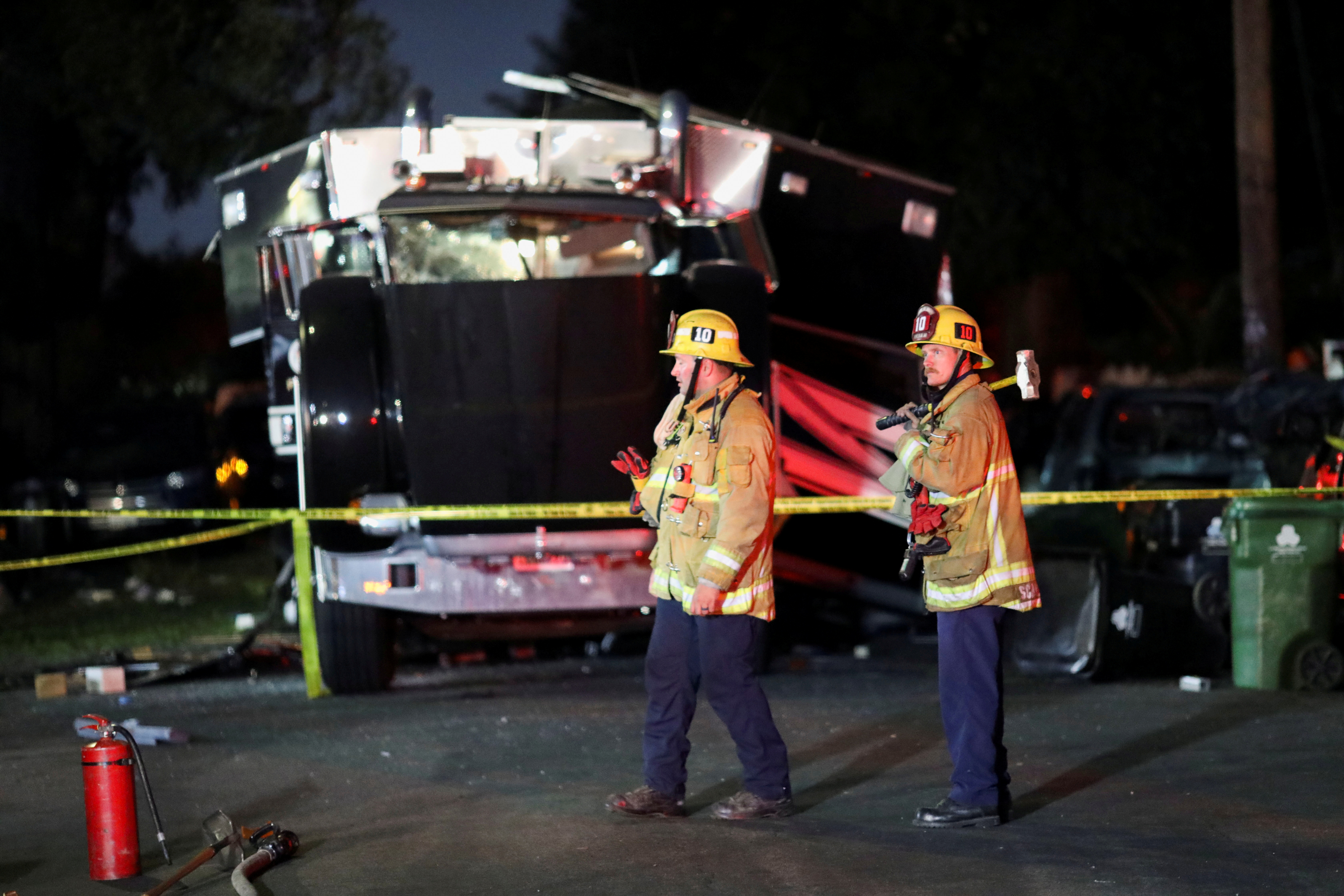 A damaged vehicle is seen at the site of an explosion after police attempted to safely detonate illegal fireworks that were seized, in Los Angeles, California, U.S., June 30, 2021. REUTERS/David Swanson     TPX IMAGES OF THE DAY