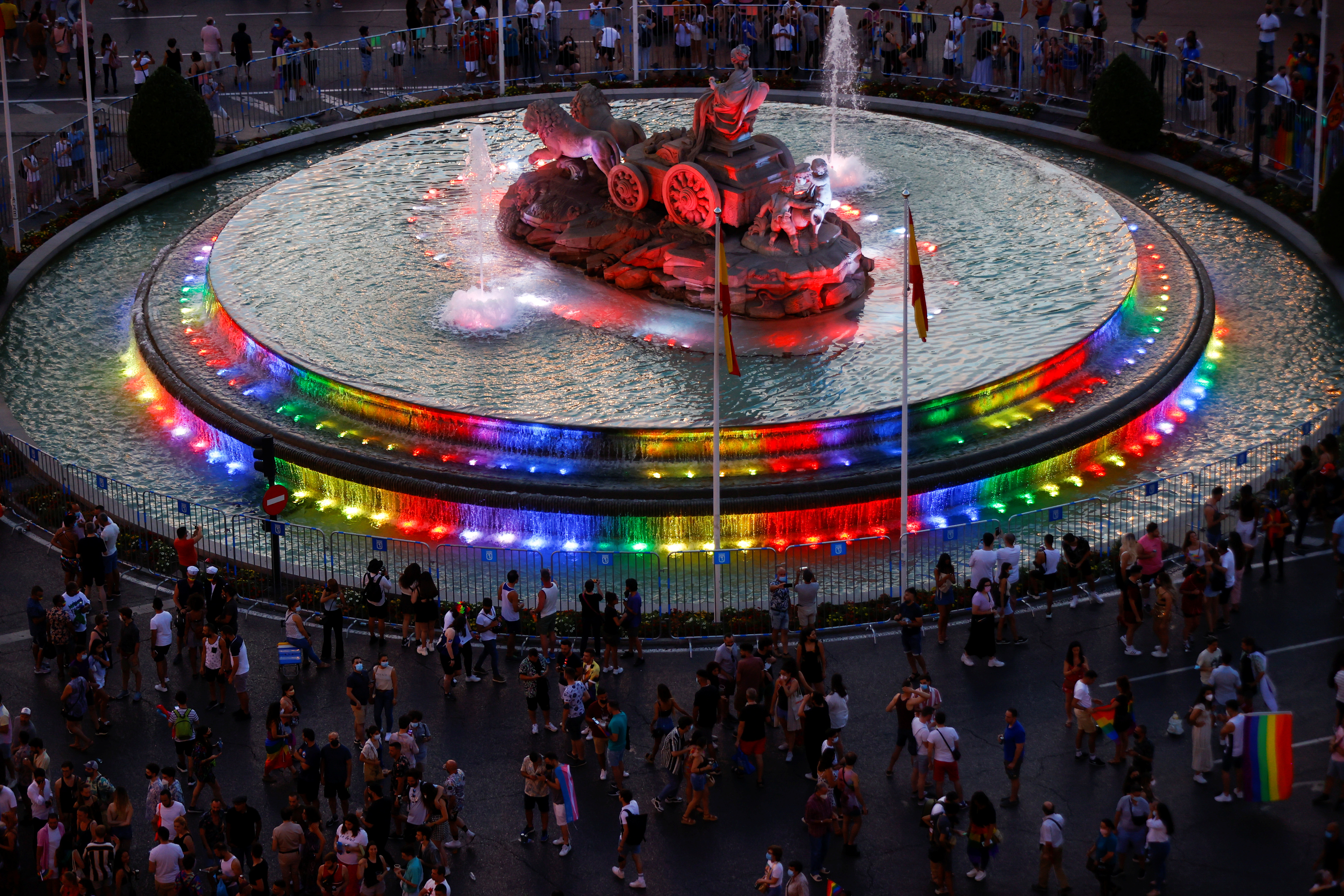The Cibeles fountain is seen with rainbow colours projected on it during the Gay Pride parade in Madrid, Spain, July 3, 2021. REUTERS/Sergio Perez