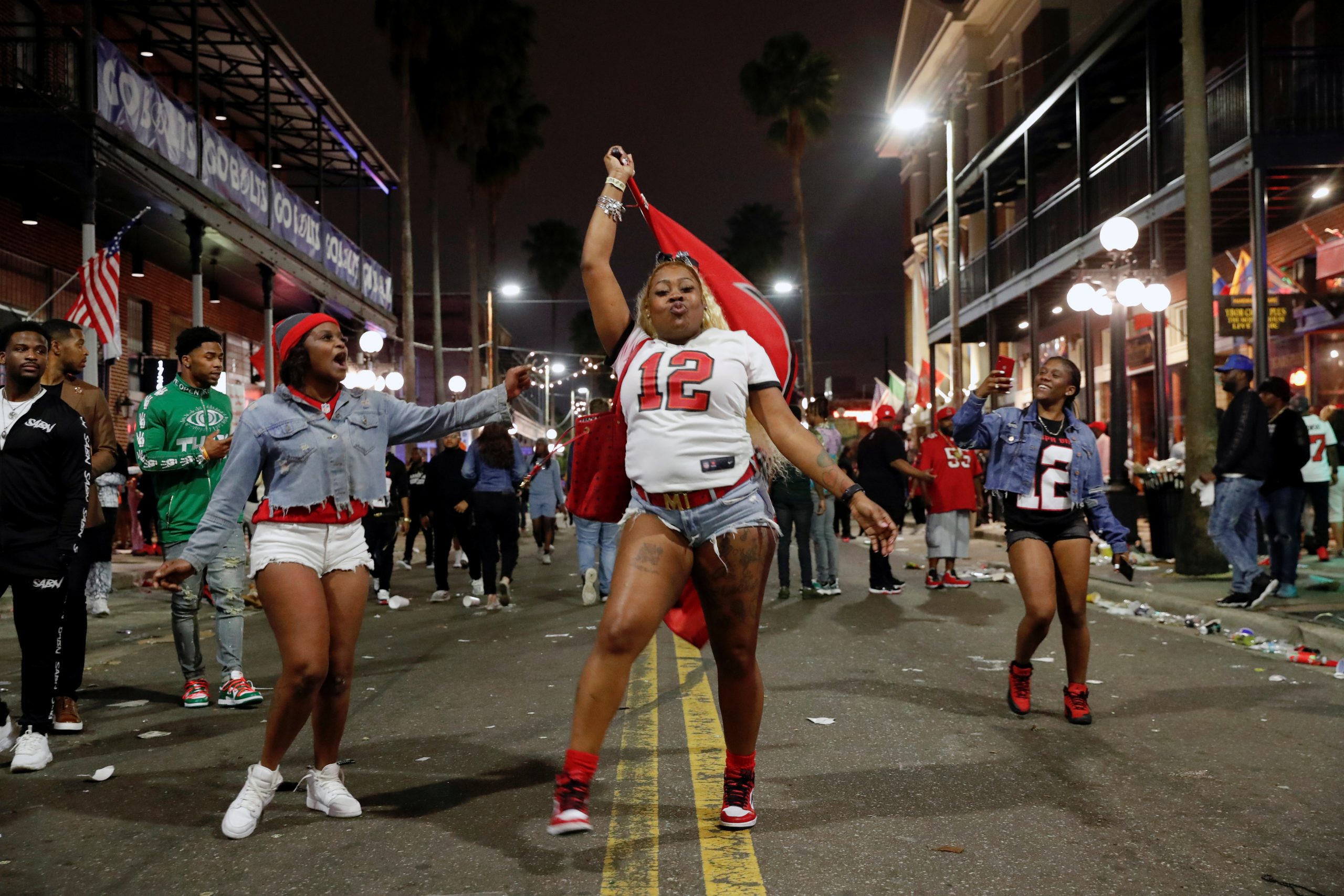 People gather in Ybor city after the Tampa Bay Buccaneers Super Bowl LV win over the Kansas City Chiefs, in Tampa, Florida, U.S., February 8, 2021. REUTERS/Shannon Stapleton