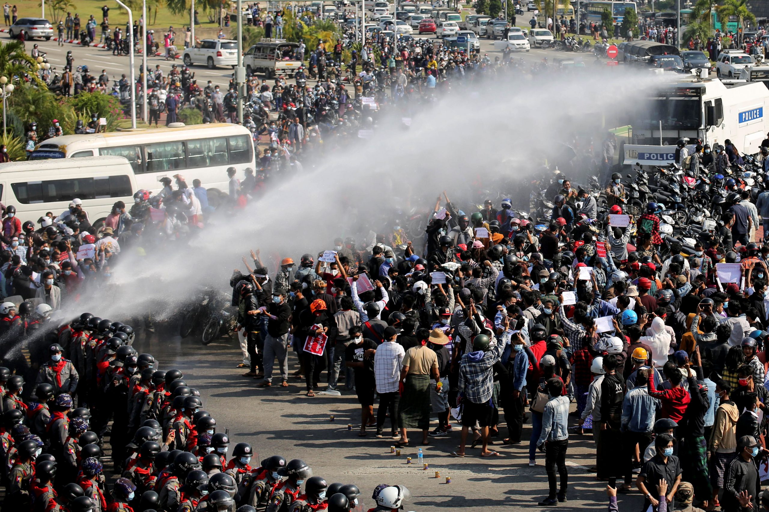 Police fire a water cannon at protesters demonstrating against the coup and demanding the release of elected leader Aung San Suu Kyi, in Naypyitaw, Myanmar, February 8, 2021. REUTERS/Stringer NO RESALES. NO ARCHIVES.