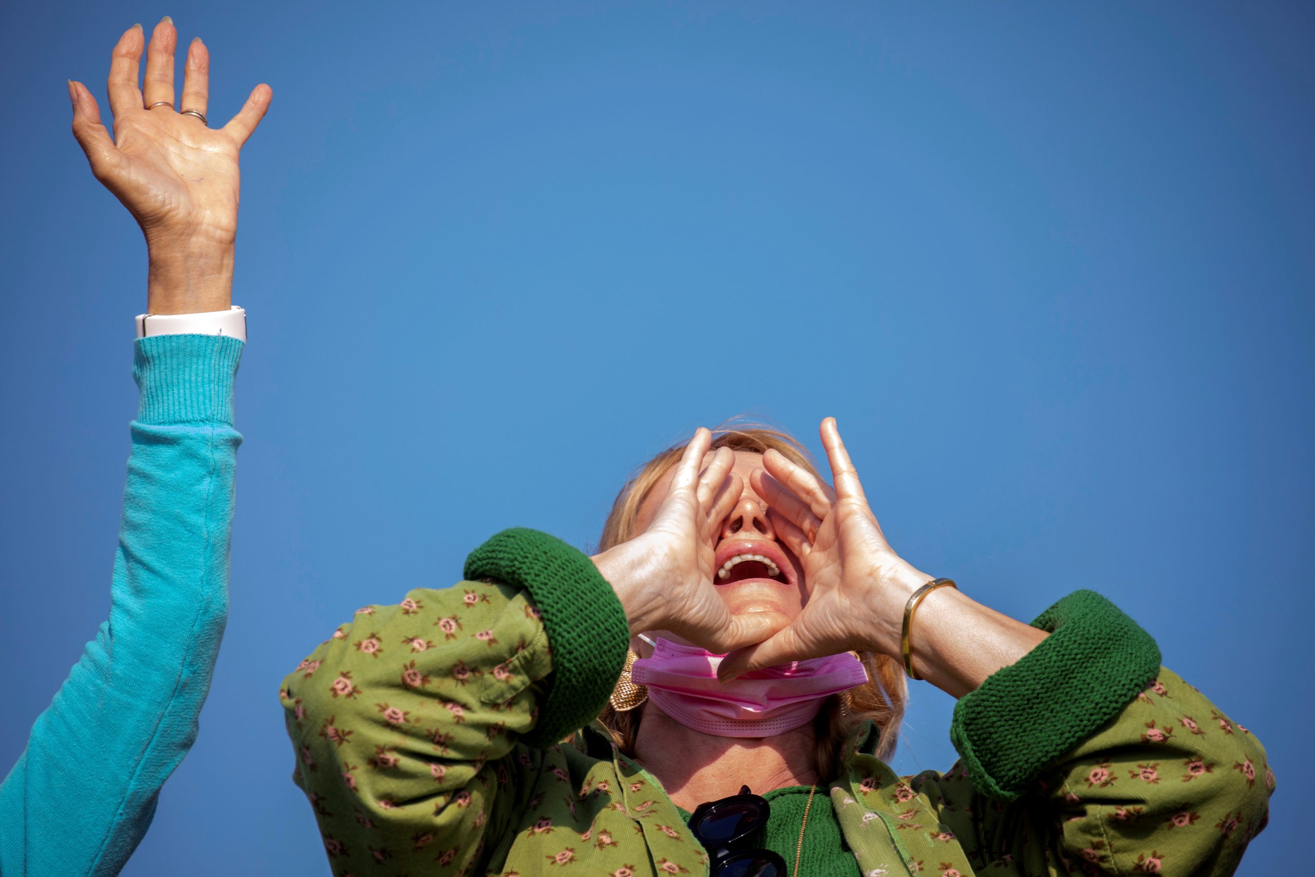 A woman takes part in a screaming session with a group seeking emotional release from coronavirus disease (COVID-19) confinements, in an open area near Ra'anana, Israel February 7, 2021. Picture taken February 7, 2021. REUTERS/Amir Cohen