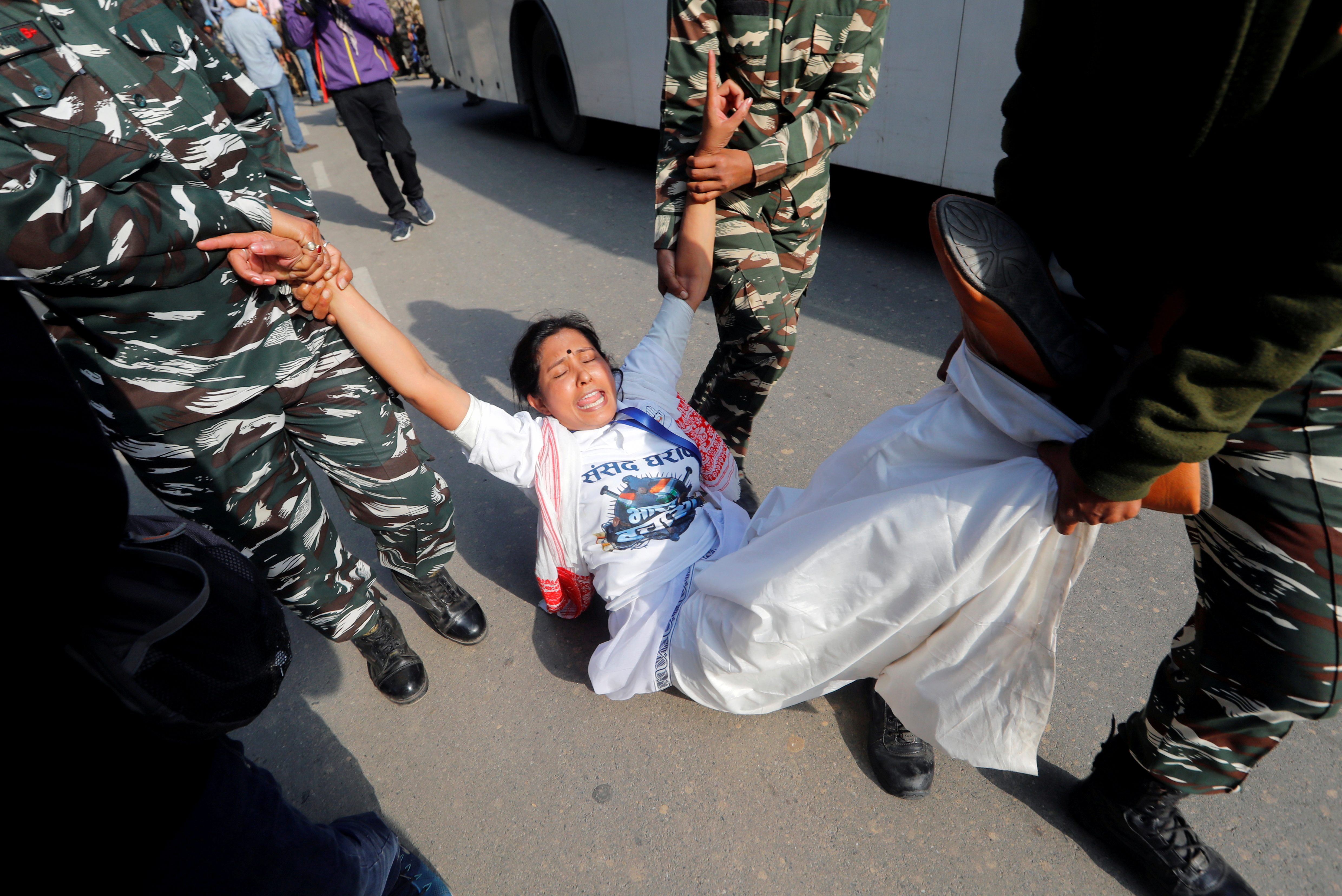 Police officers detain an activist of the youth wing of India's main opposition Congress party during a protest against farm laws in New Delhi, India, February 9, 2021. REUTERS/Adnan Abidi     TPX IMAGES OF THE DAY