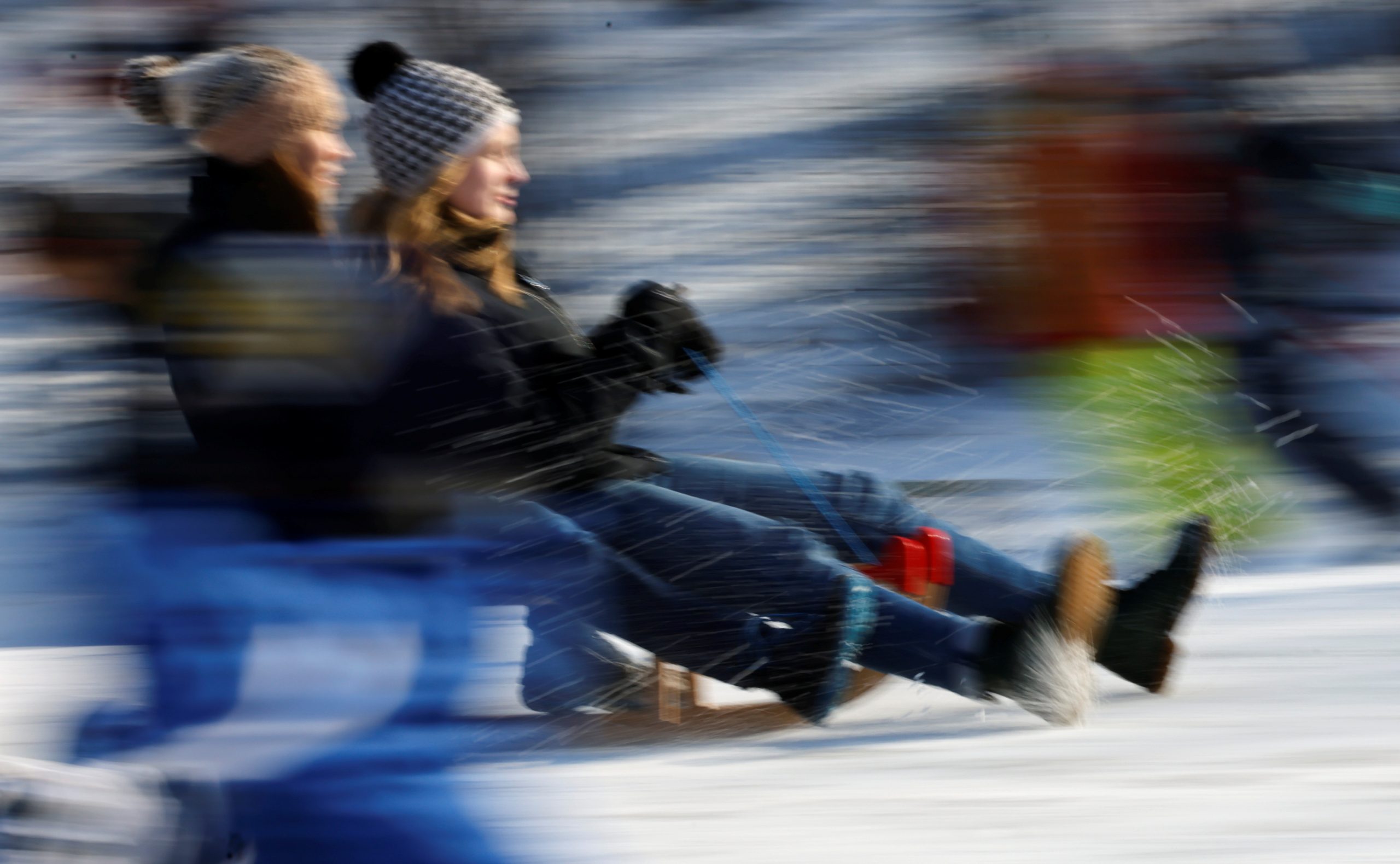 10022021 People use their sledges at Volkspark Wilmersdorf during a sunny day following snowfall in Berlin, Germany, February 10, 2021. REUTERS/Fabrizio Bensch