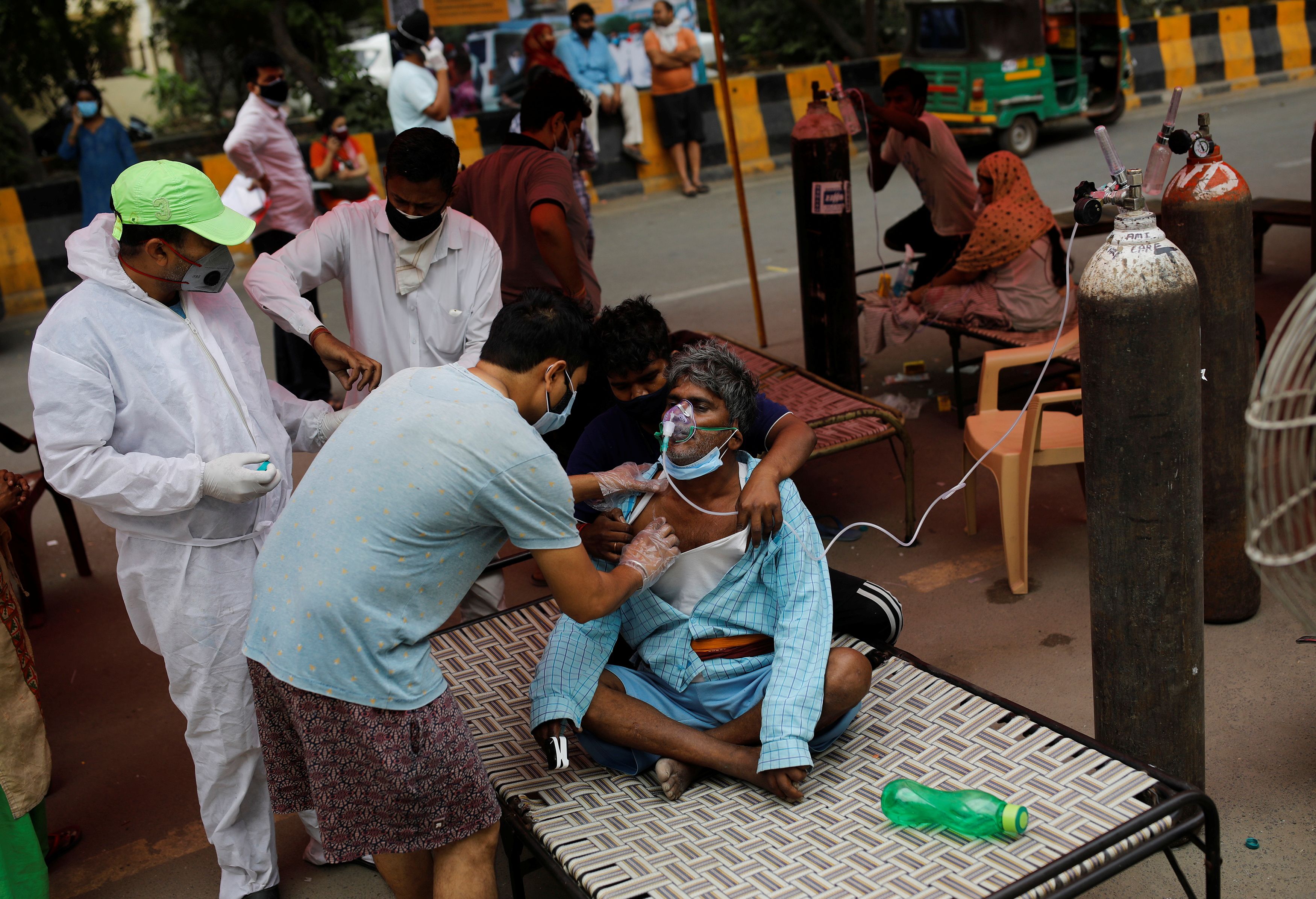 Nanhe Pal, 52, receives oxygen support for free at a Gurudwara amidst the spread of coronavirus disease (COVID-19), in Ghaziabad