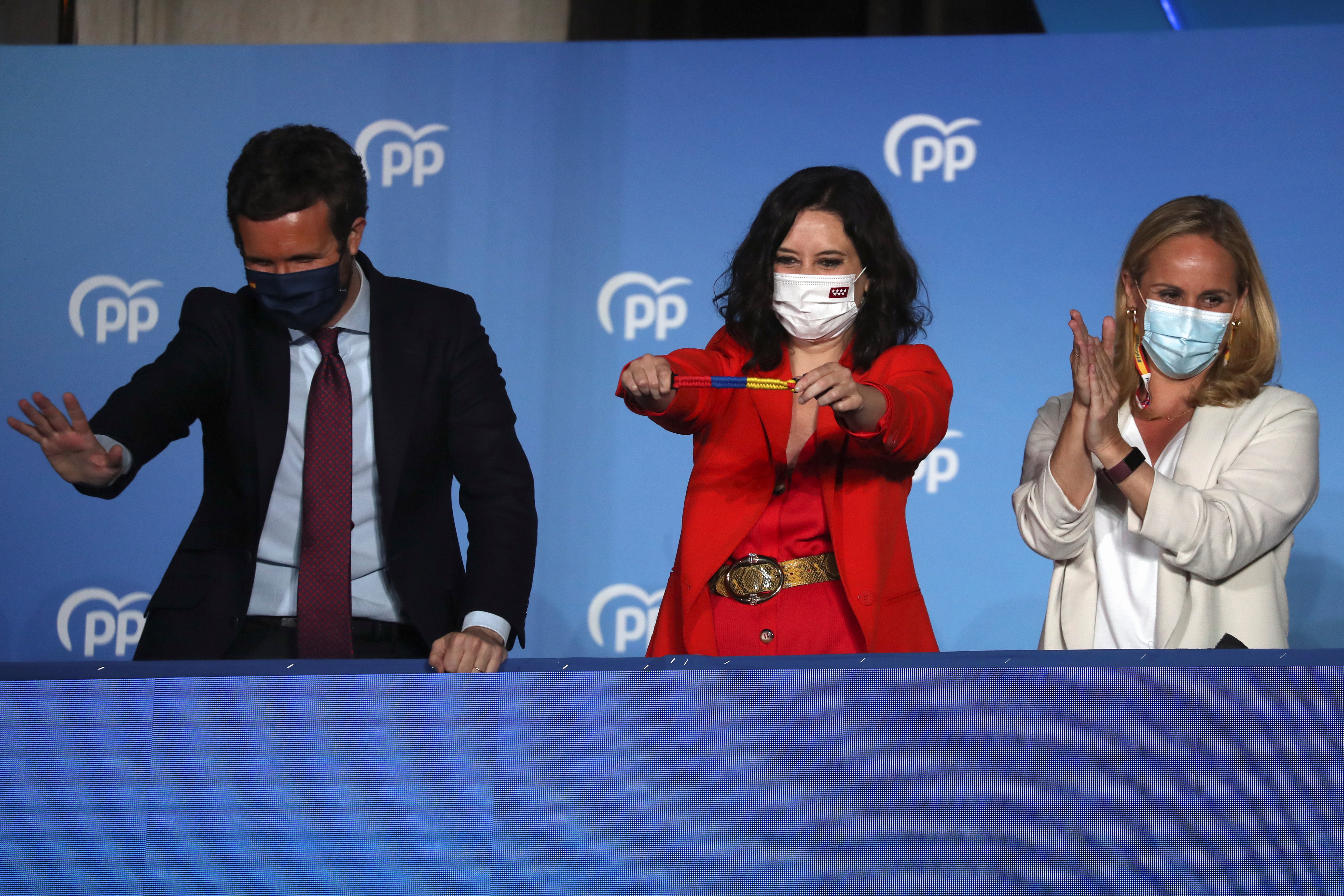 Madrid regional government leader and Popular Party's (PP) candidate Isabel Diaz Ayuso and national PP leader Pablo Casado celebrate the regional election results at the balcony of PP's headquarters, in Madrid, Spain, May 4, 2021. REUTERS/Susana Vera