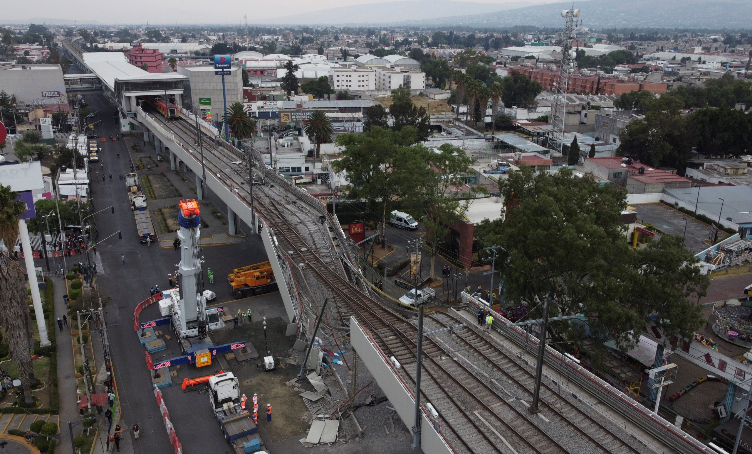 A general view of the damage caused after a railway overpass and train collapsed onto a road in Mexico City, Mexico May 4, 2021. Picture taken with a drone. REUTERS/Carlos Jasso