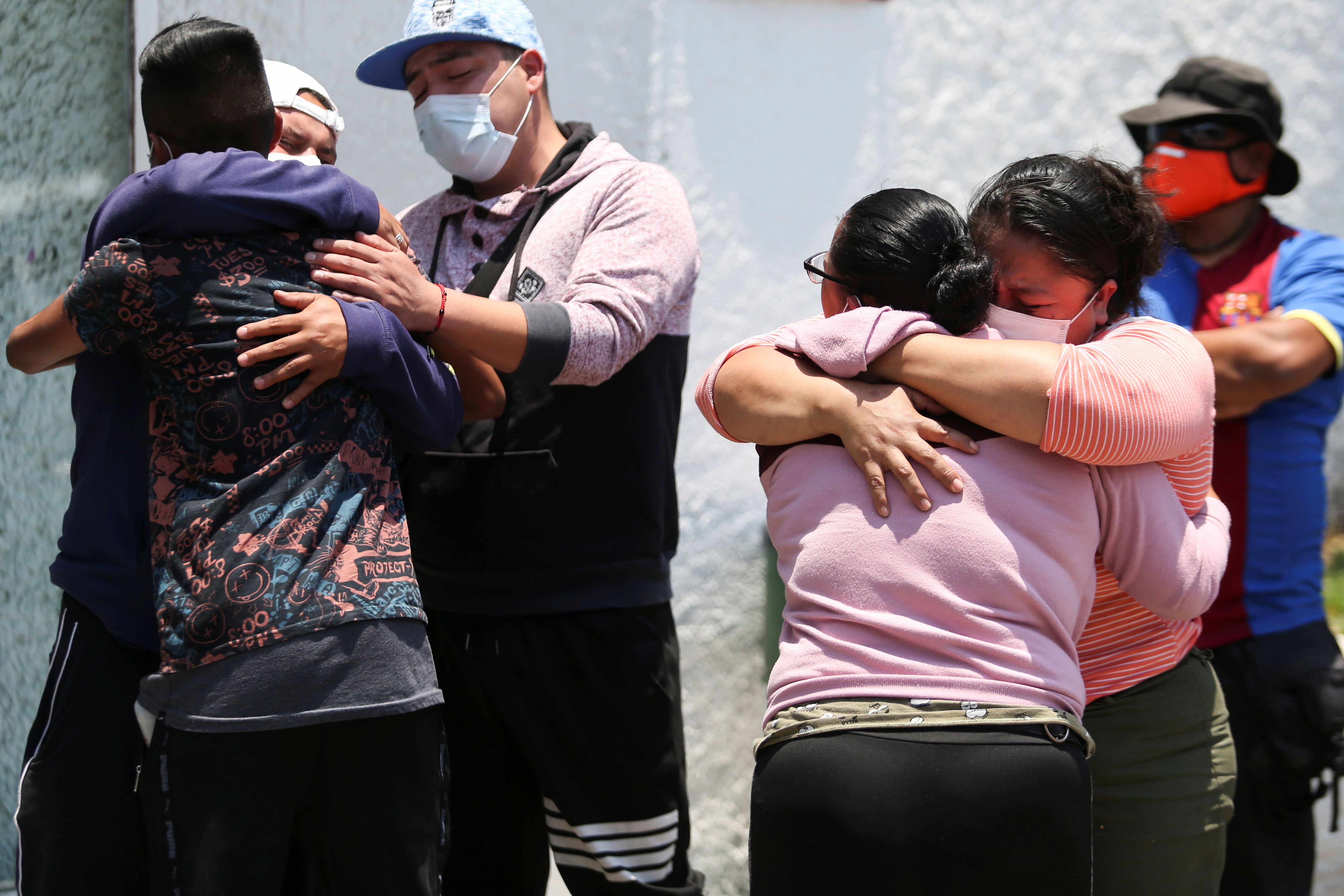 Relatives of the victims react outside the Prosecutor's Office in Iztapalapa neighbourhood, after the accident where an overpass of the metro partially collapsed with train cars on it, in Mexico City, Mexico May 4, 2021. REUTERS/Edgard Garrido